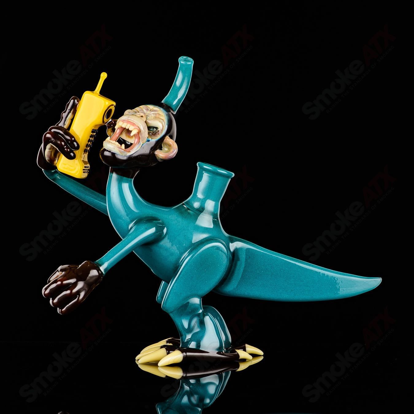 Elbo Glass Coyle x Elbo Dino Monkey heady glass concentrate rig with colorful dinosaur design and intricate glasswork.