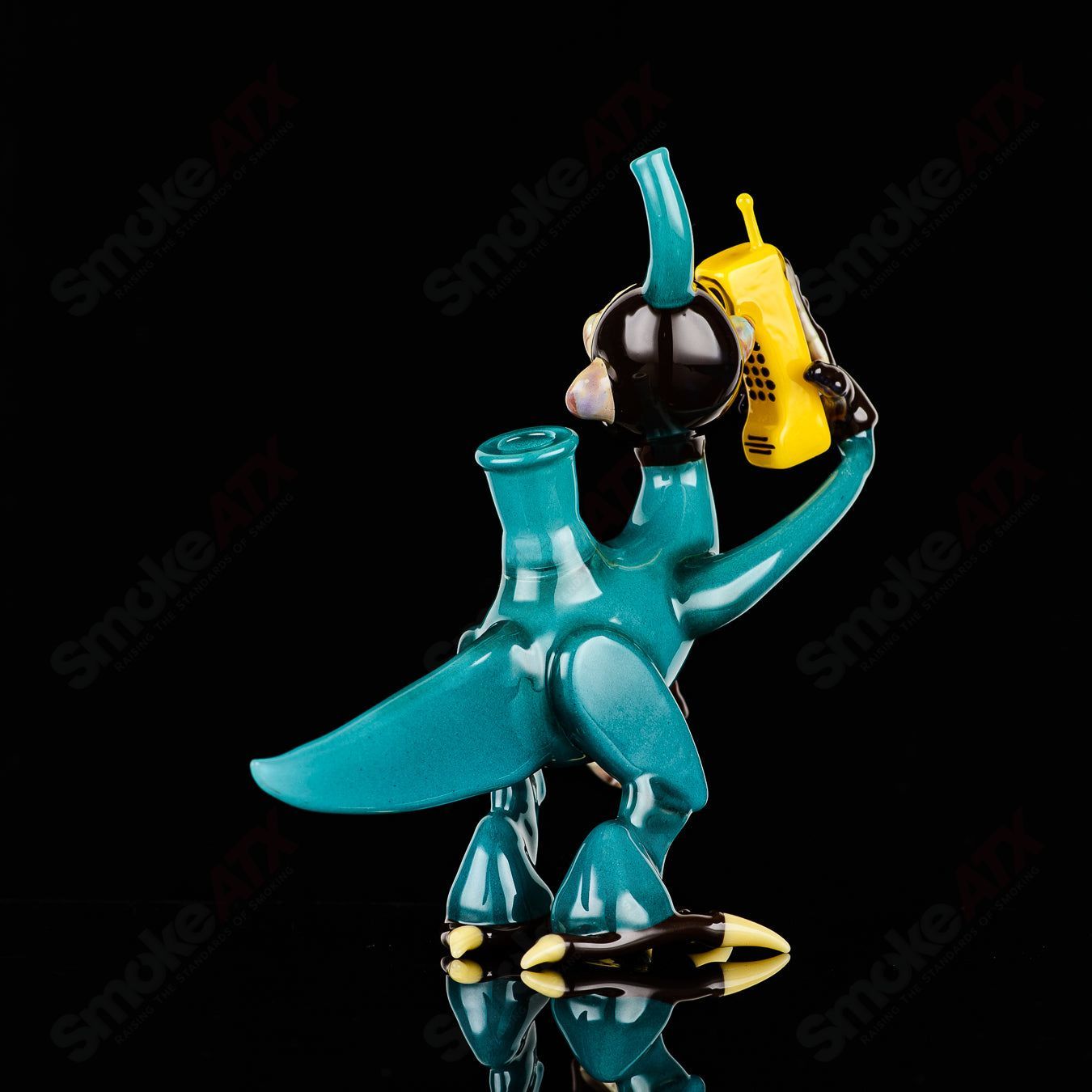 Elbo Glass Coyle x Elbo Dino Monkey heady glass concentrate rig with colorful dinosaur design and intricate glasswork.