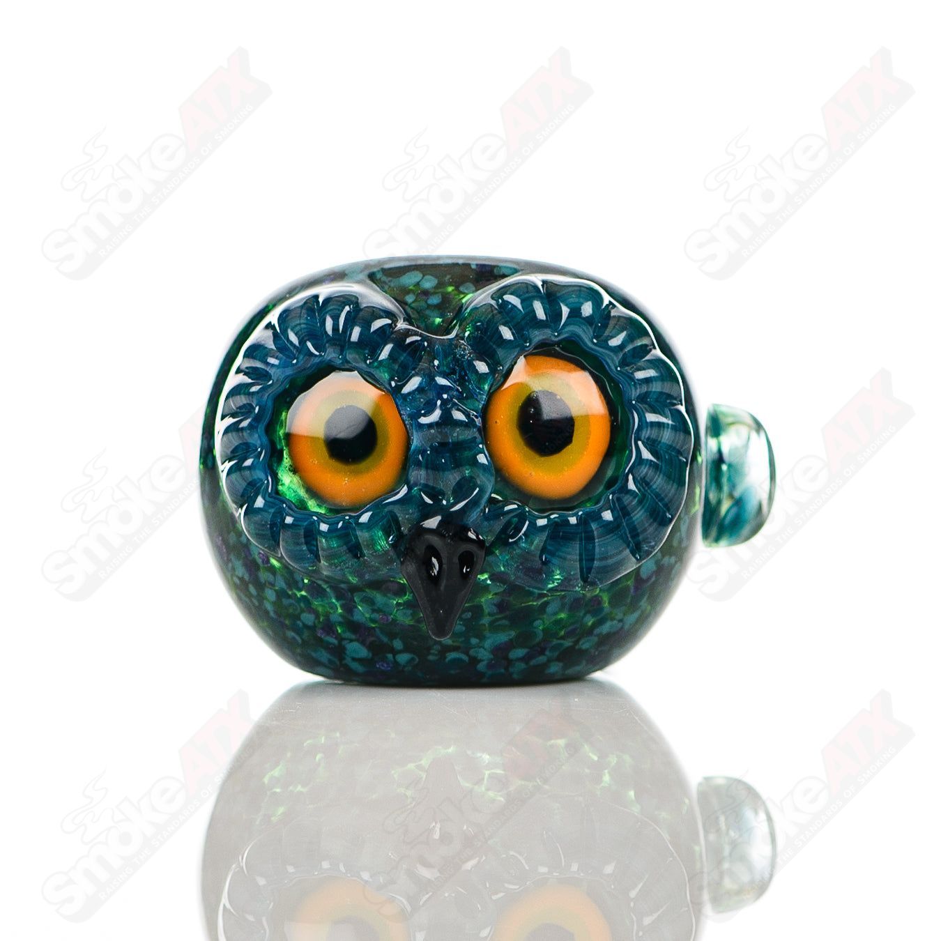 Cyan spotted owl glass spoon pipe by Four Winds Flameworks, featuring detailed owl design and vibrant blue accents.