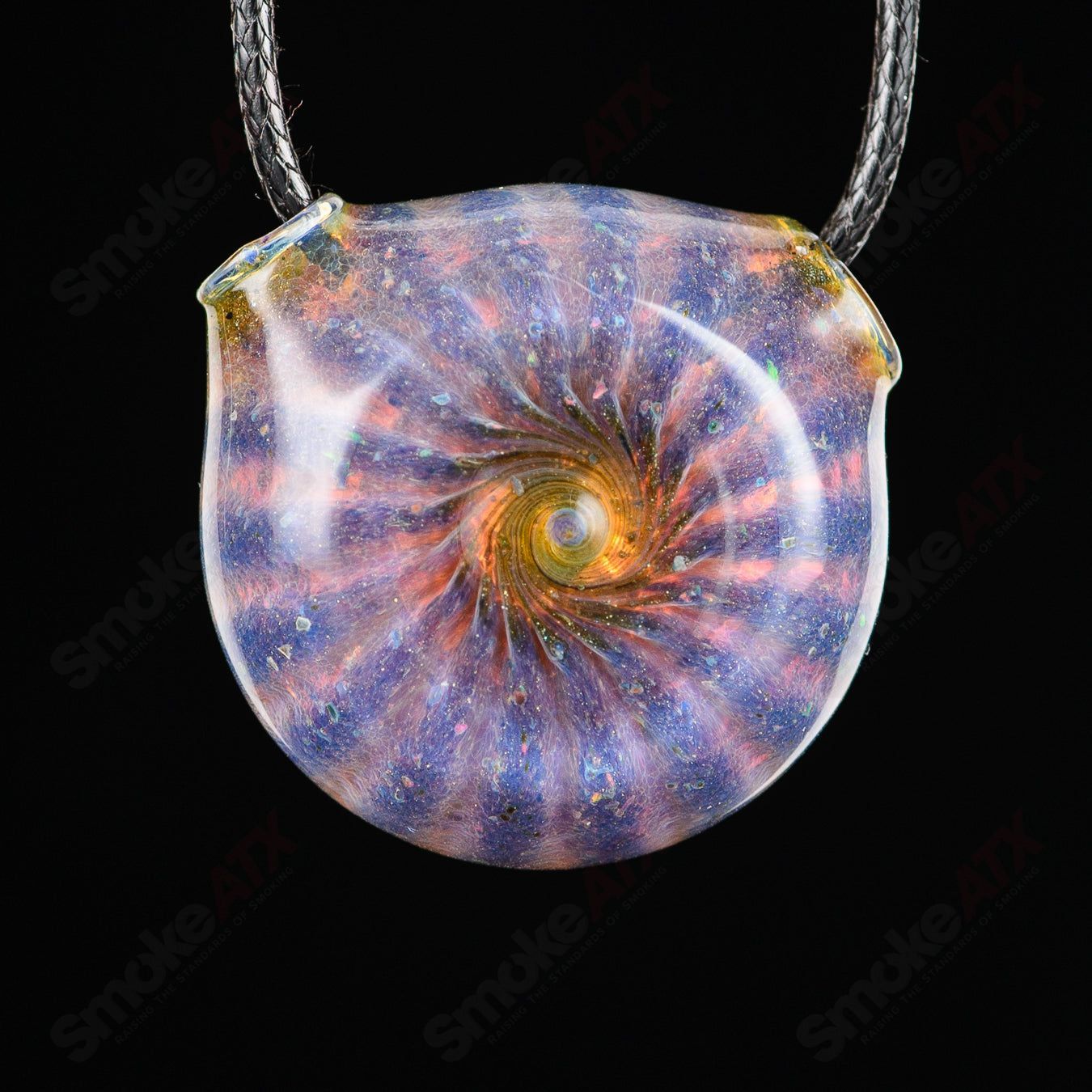 Dichro glass pendant by Merican Made, showcasing vibrant iridescent colors and unique handcrafted design.