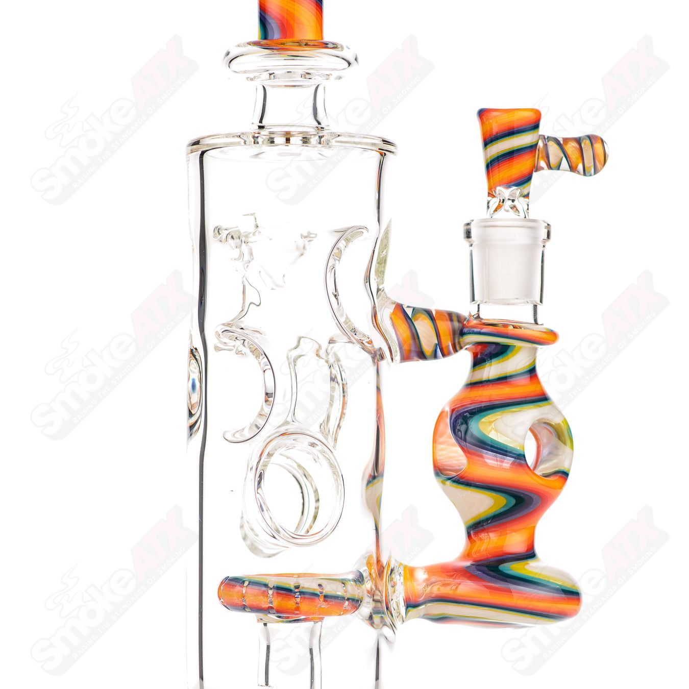 Glass donut-shaped bubbler rig by Texas Hot Glass featuring a colorful, artistic design with a rounded bowl and intricate glasswork.