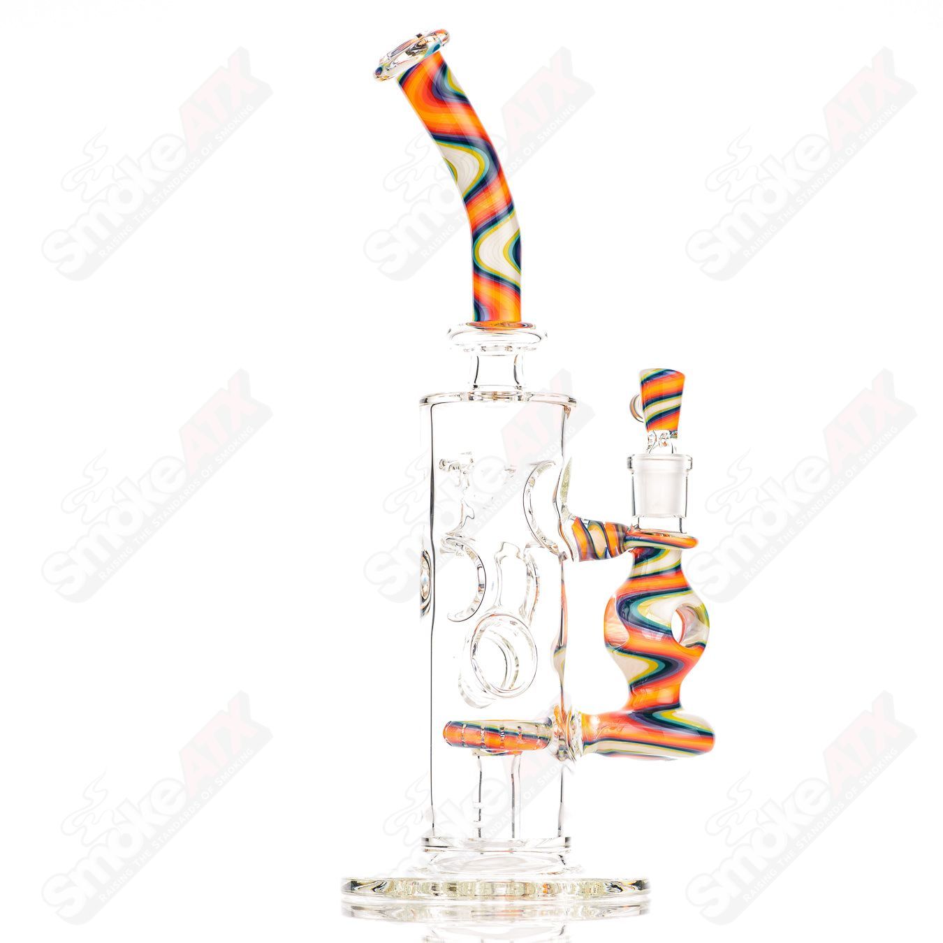 Glass Donut Ball Rig by Texas Hot Glass, a colorful bubbler with a donut-shaped design and intricate glasswork.