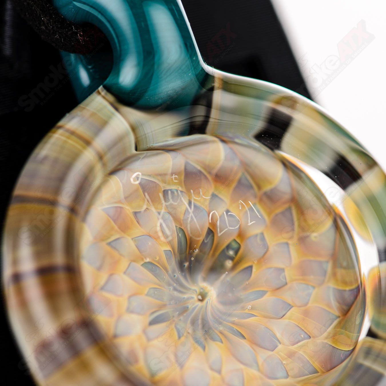 JuJu Glass Dotstack Pendant made of clear glass with colorful dot patterns, hanging on a silver chain.