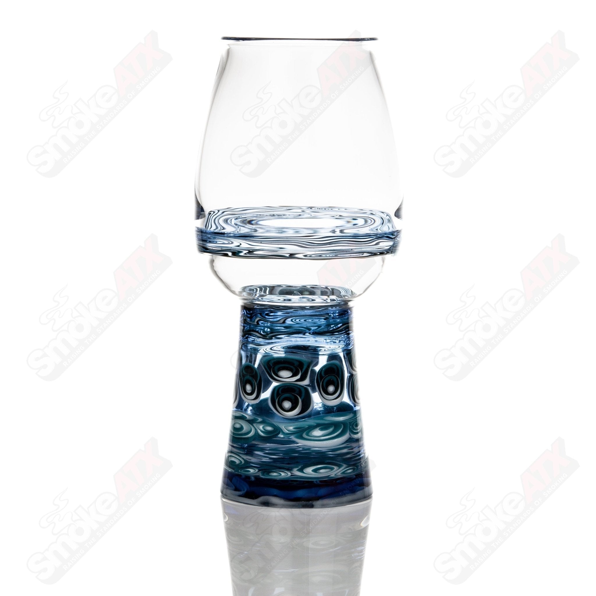 Dotstack pint glass by Stephen Pierce x Indo, clear heady glass cup with intricate dot design and sturdy base.