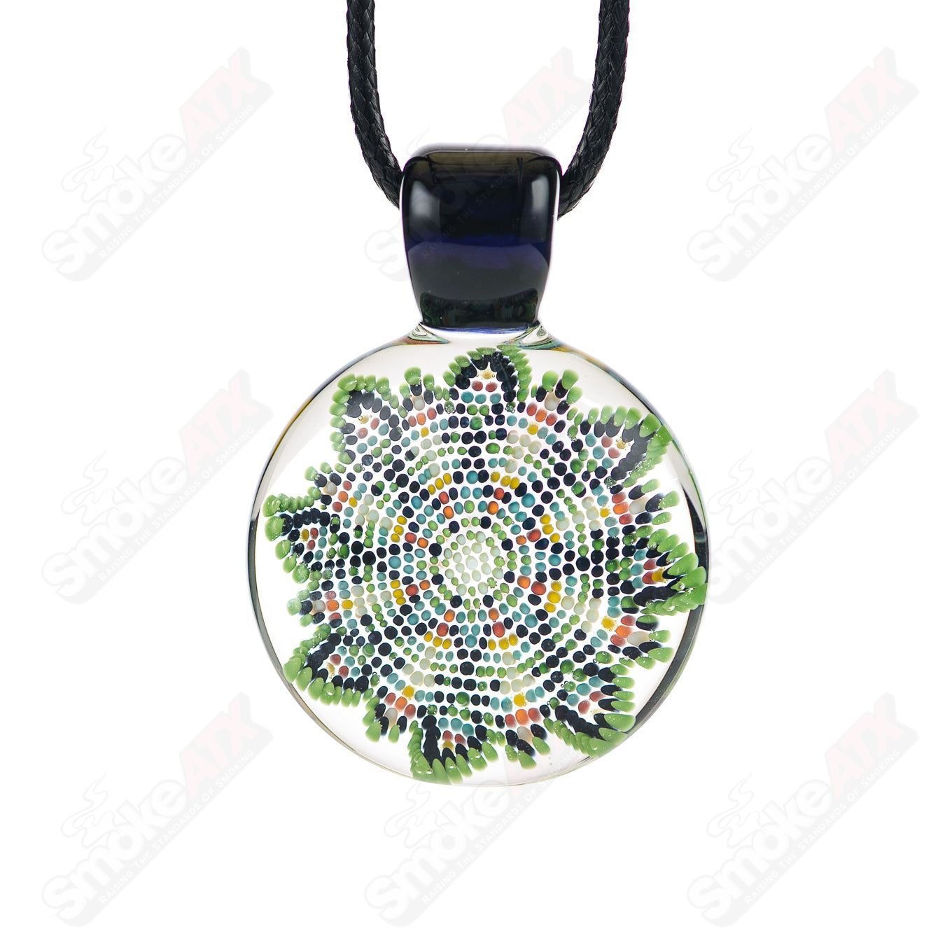 Glass Dotwork Pendant by Robin Moore featuring intricate black and white dotwork design, hanging on a silver chain.