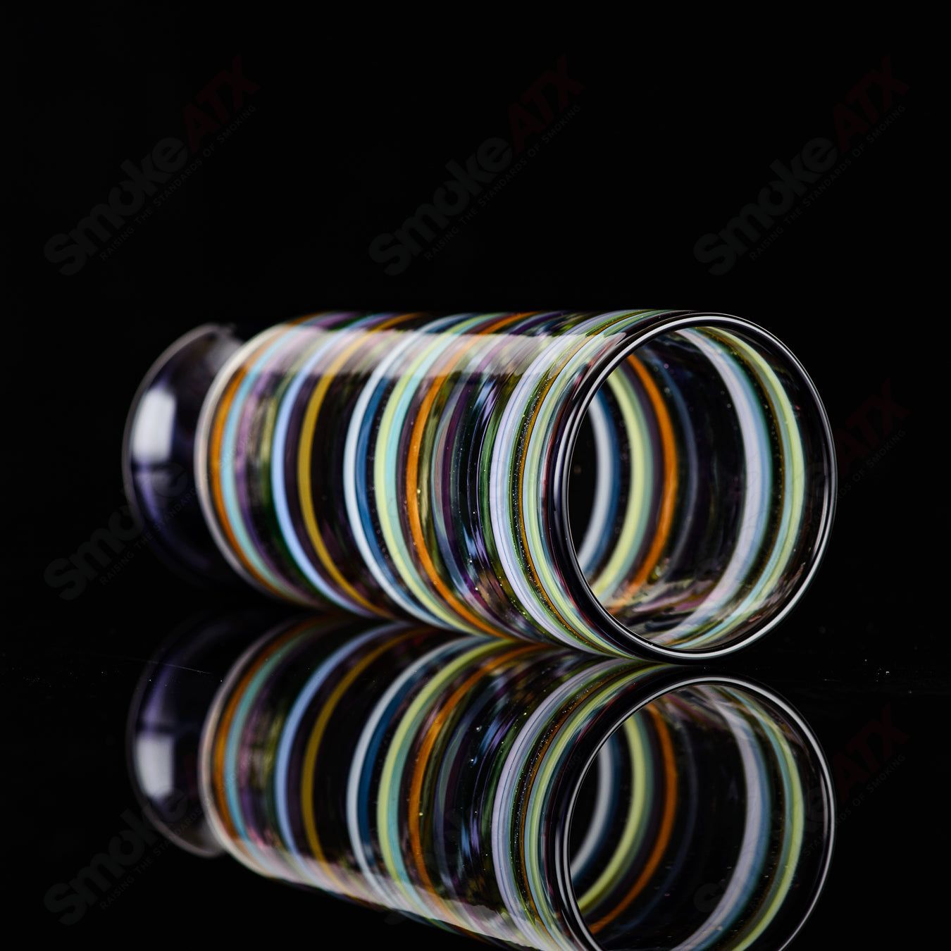 Encalmo pint glass by Freeek Glass, a clear heady glass cup with a smooth, artistic design for drinking and display.