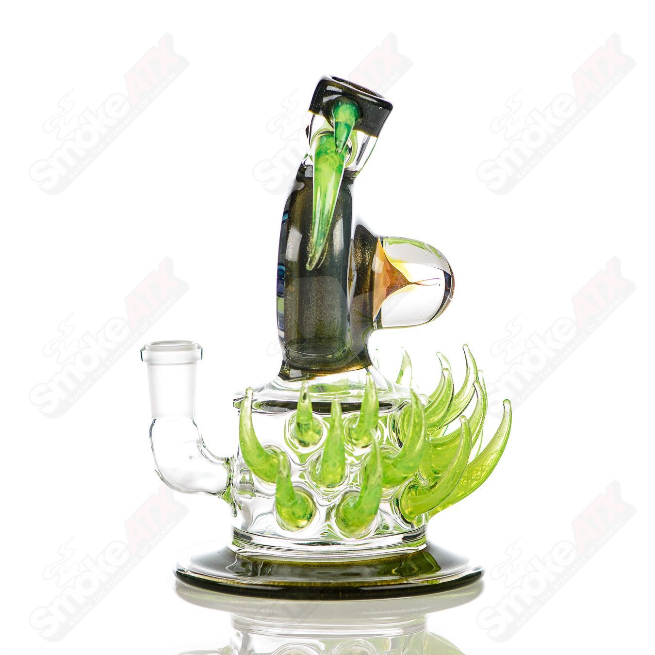 Fillacello DiscRig by Freeek Glass, a colorful Slyme heady glass concentrate rig with intricate design and disc-shaped base.