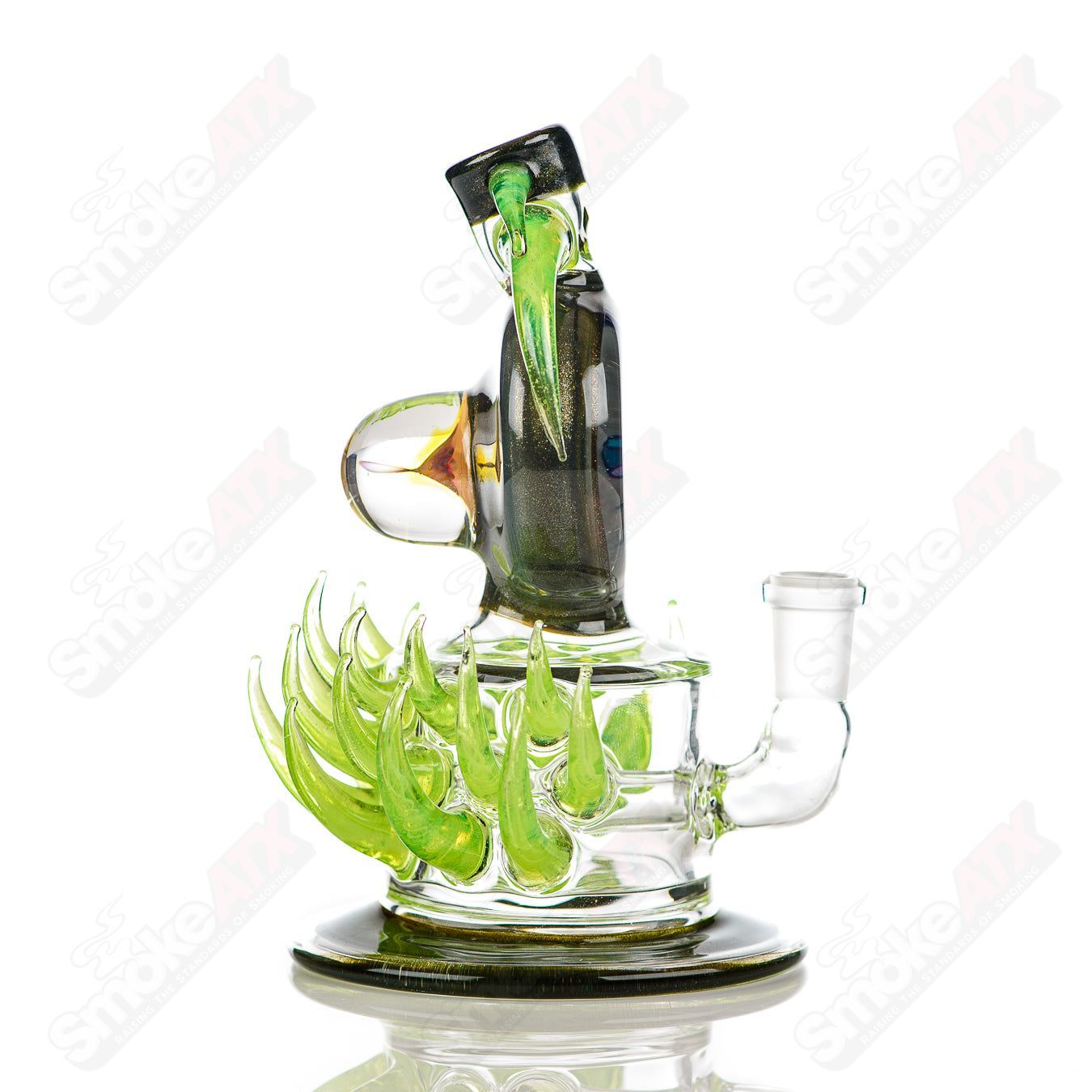 Fillacello DiscRig by Freeek Glass, a heady glass concentrate rig with vibrant Slyme design, featuring a unique disc-shaped base.