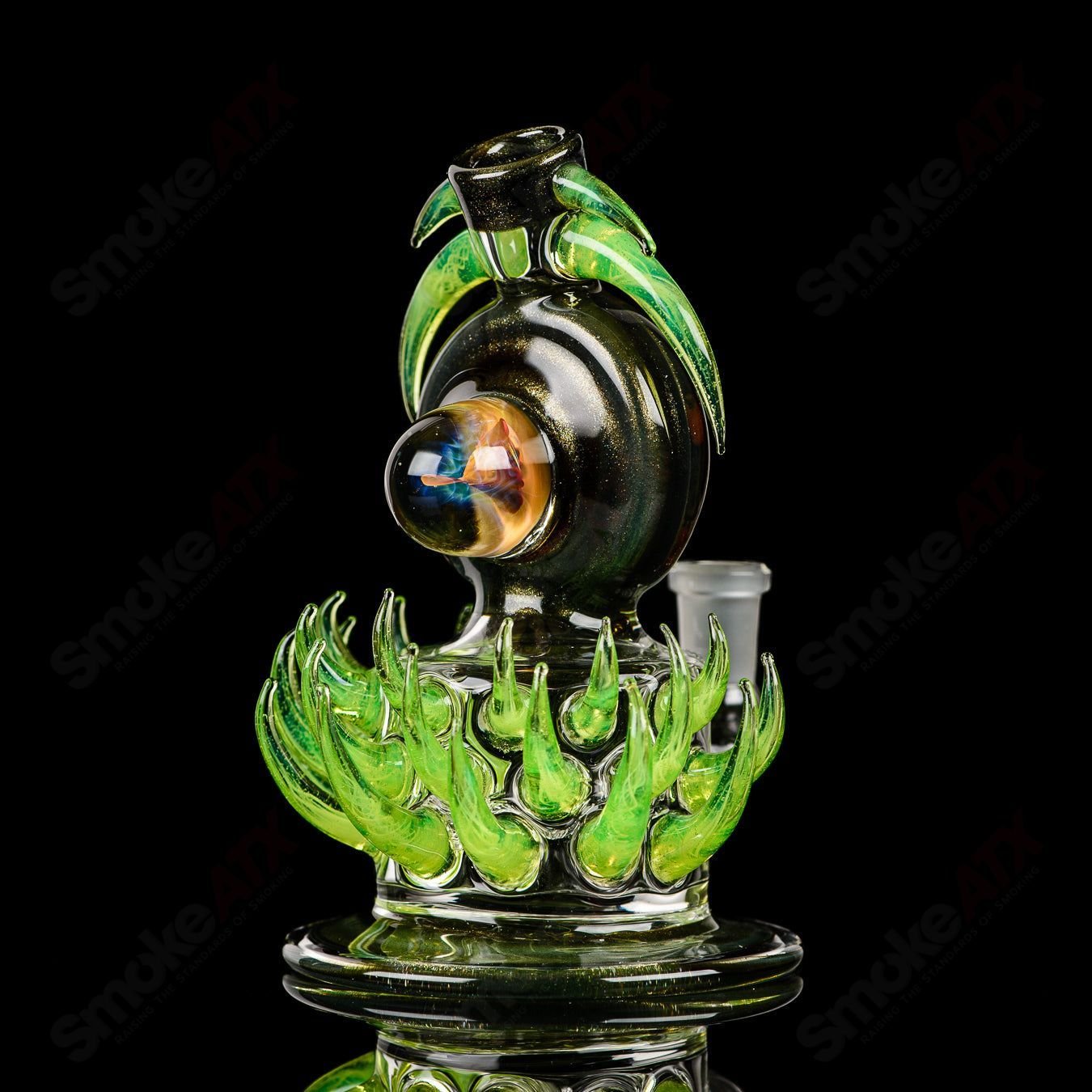 Fillacello DiscRig by Freeek Glass, a heady glass concentrate rig featuring a vibrant Slyme design and intricate glasswork.