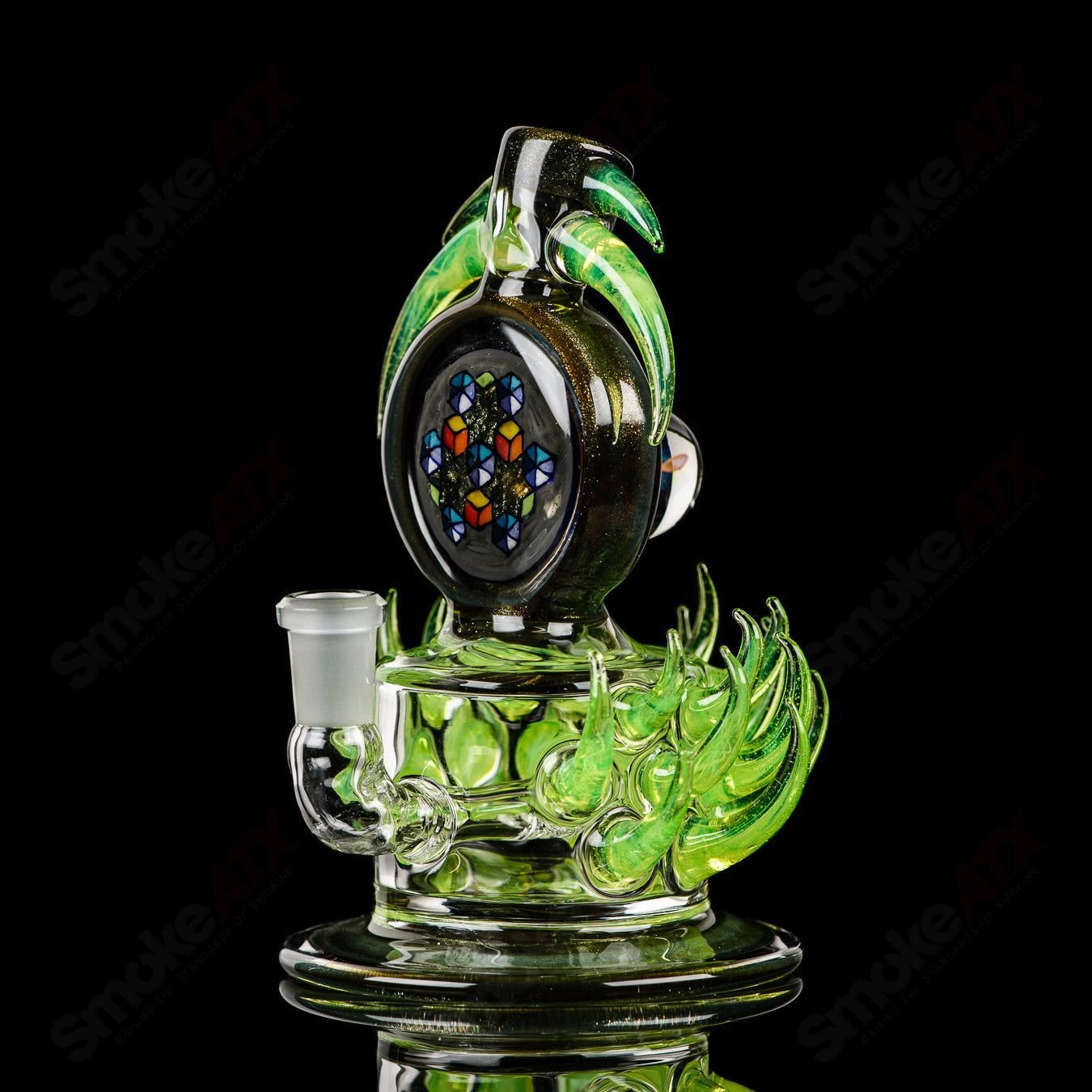 Fillacello DiscRig by Freeek Glass featuring Slyme design, a colorful heady glass concentrate rig with intricate details.