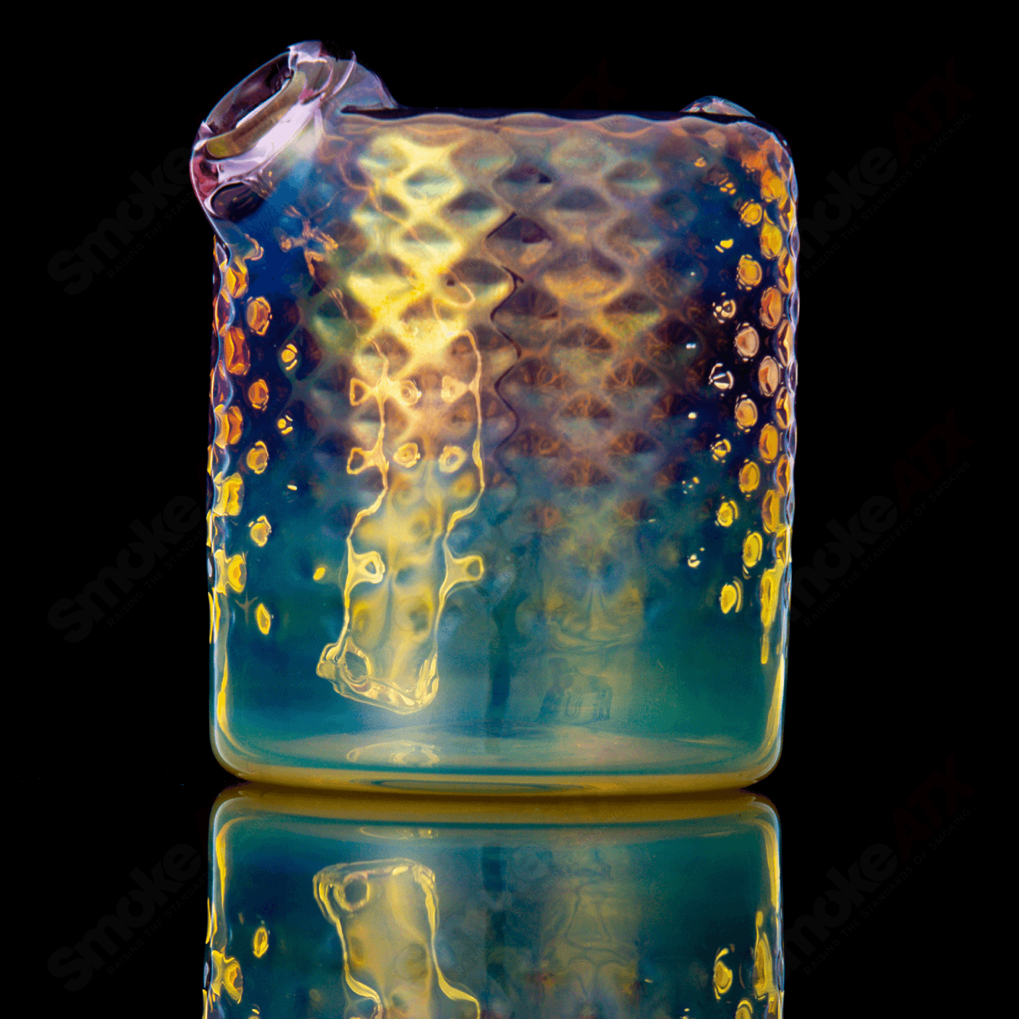 Fumed round glass concentrate rig by James Lang featuring a sleek, circular design with smoky fumed glass finish.
