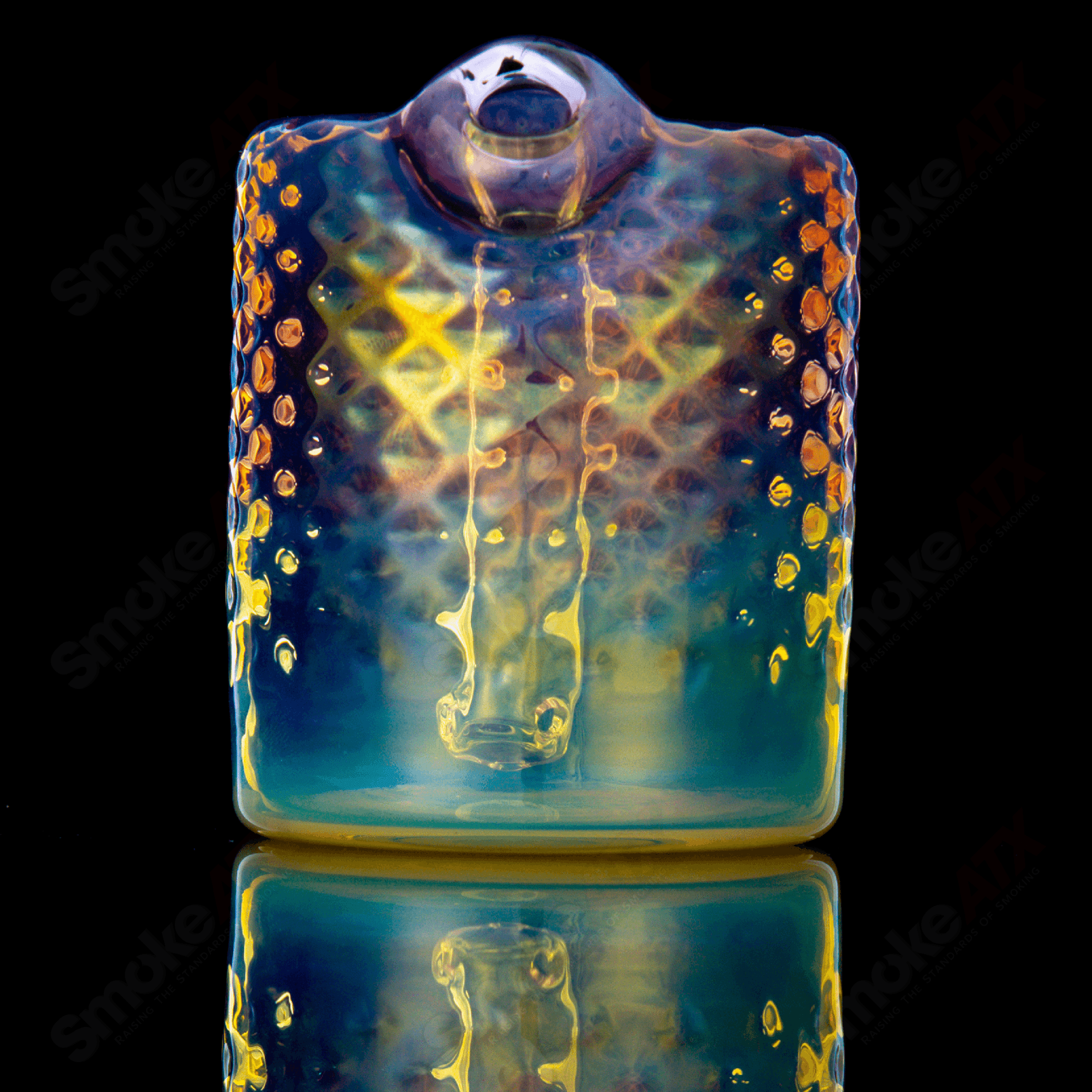 Fumed round glass concentrate rig by James Lang with a sleek, rounded design and reflective fumed finish.