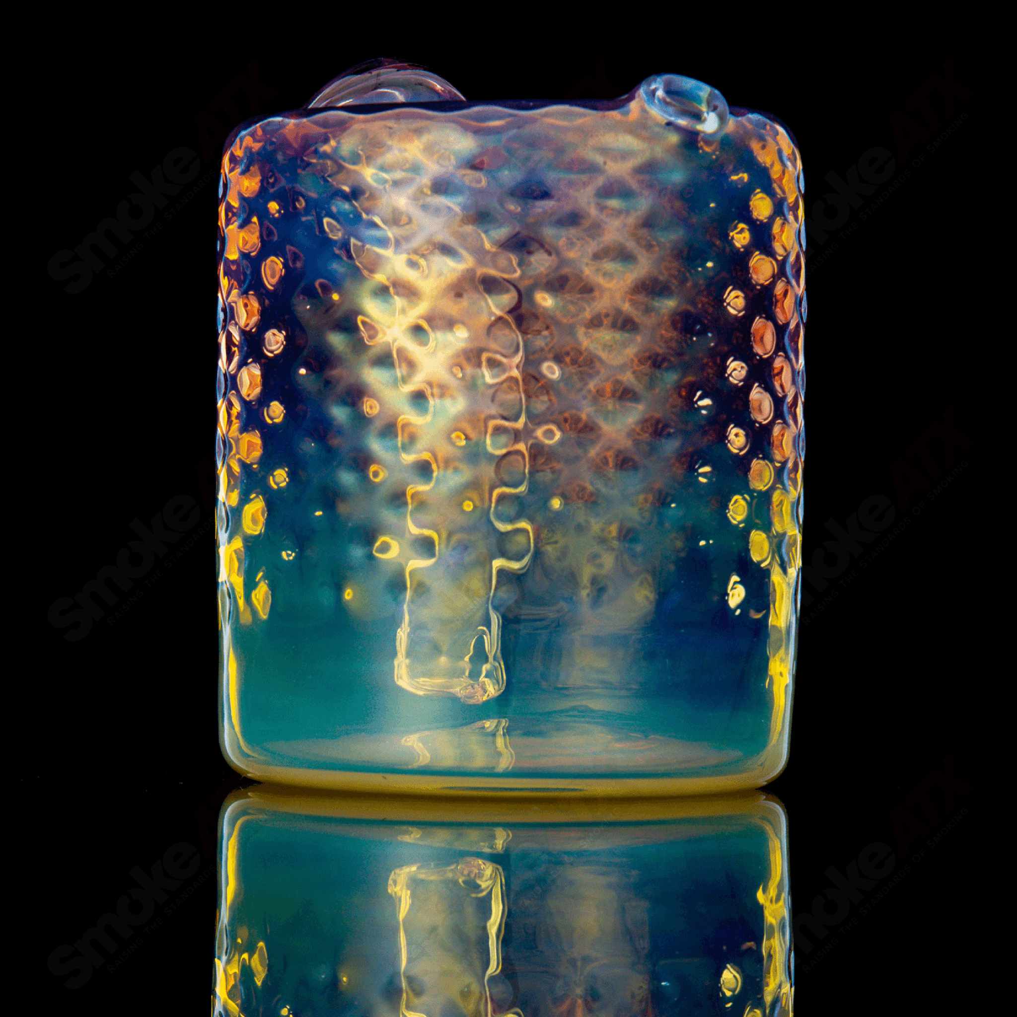 Fumed round glass rig by James Lang, designed for concentrate use, featuring a sleek, fumed finish and clear glass details.