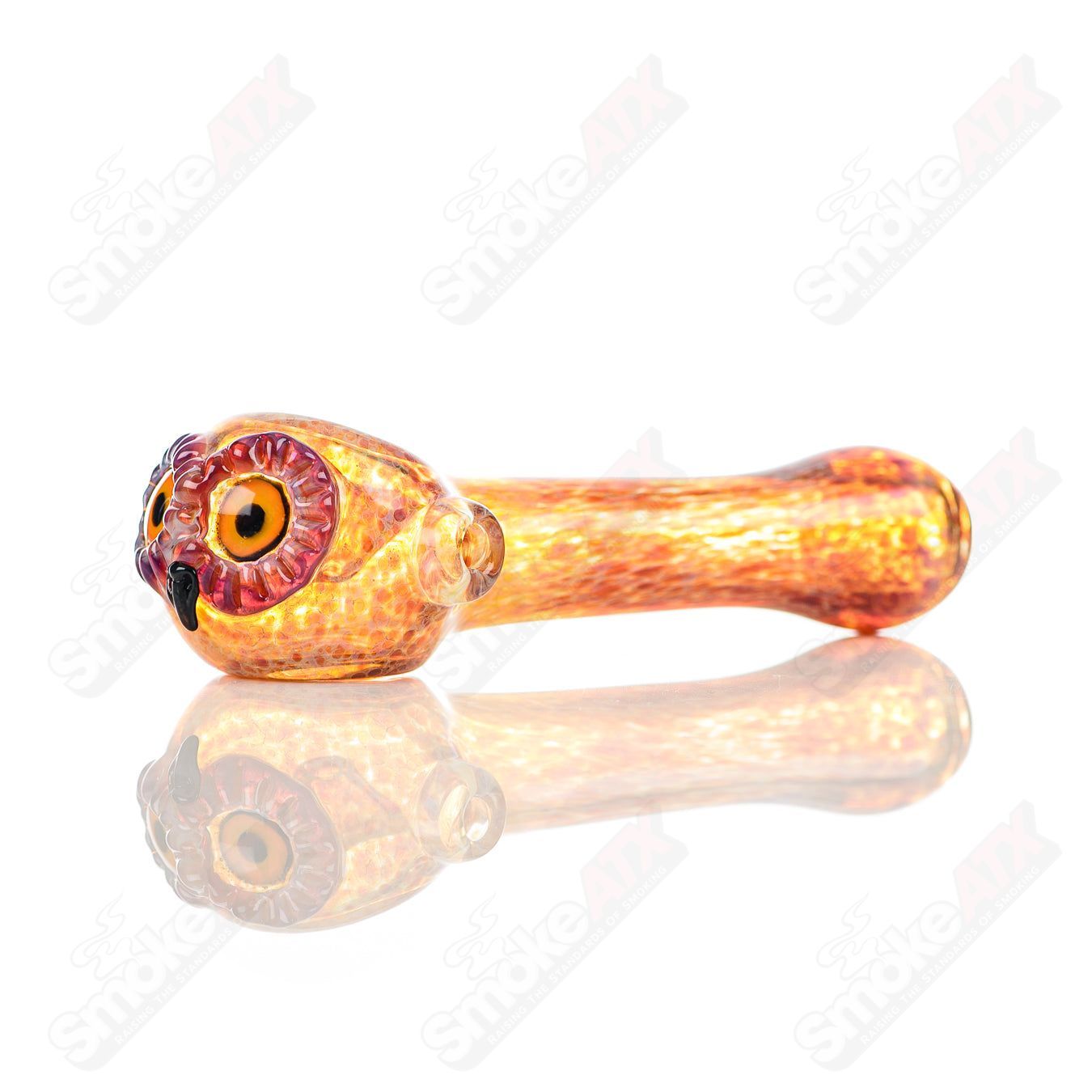 Fumed spotted owl glass spoon pipe by Four Winds Flameworks, featuring detailed owl design with smoky fumed accents.