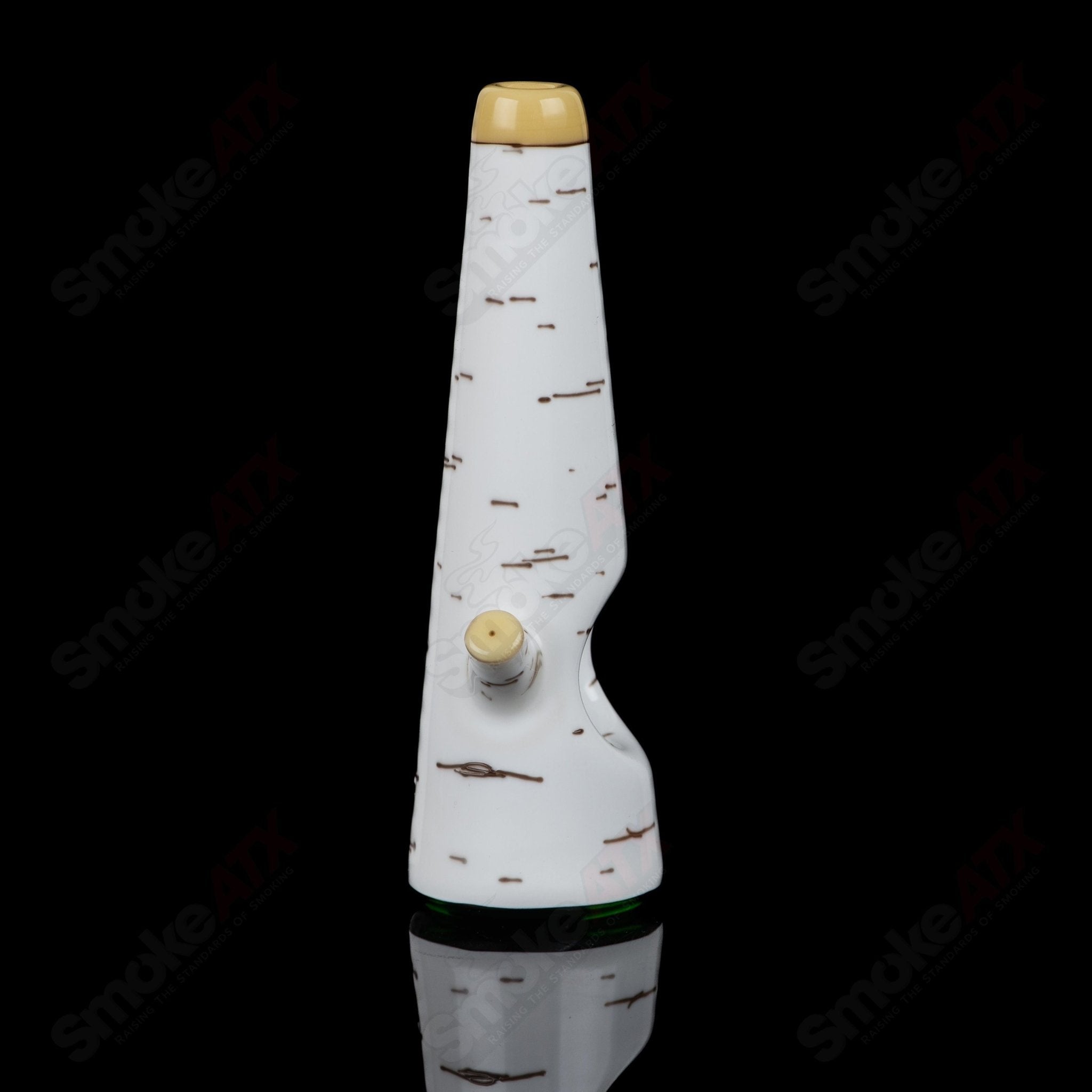 Green Birch Spoon Foster Glass hand pipe featuring a vibrant green design and intricate heady glass craftsmanship.
