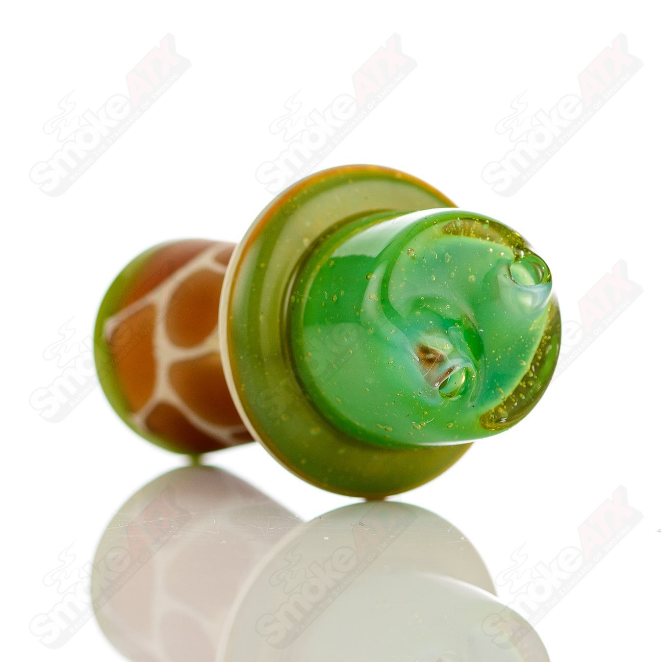 Green giraffe-shaped spinner cap with pearl accents for Robertson Glass heady glass carb cap, featuring intricate glasswork and vibrant color.