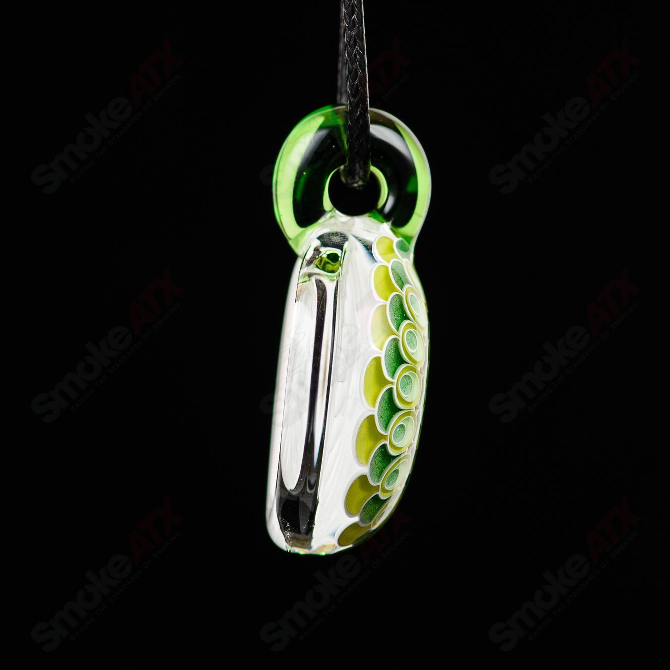 Green No Opal Dot Stack Pendant by Olour, a glass pendant featuring layered green hues and dot design, crafted by David White.