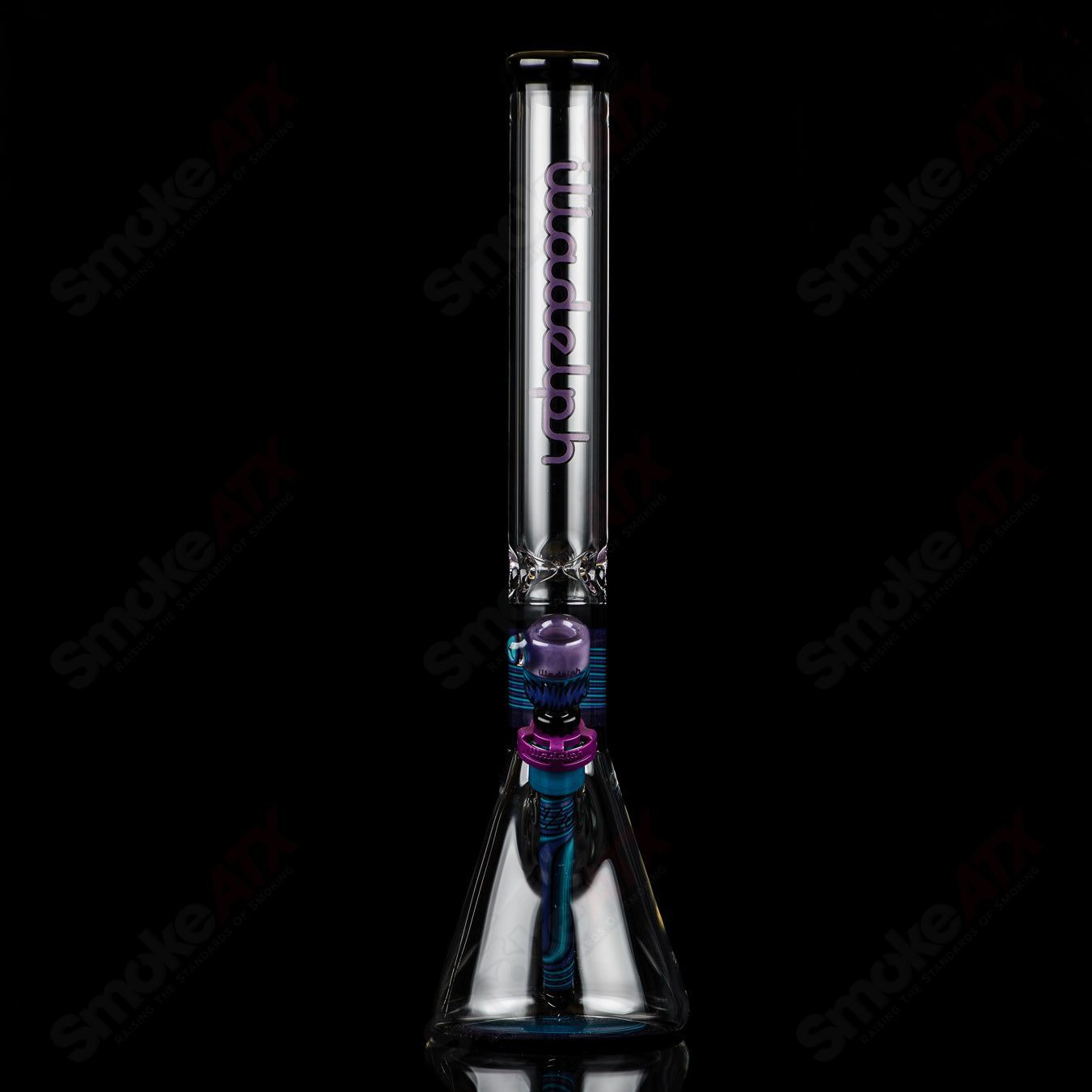 Illadelph Purple and Aqua Jordan Beaker made of heady glass with vibrant purple and aqua colors, featuring a beaker shape for smoking.