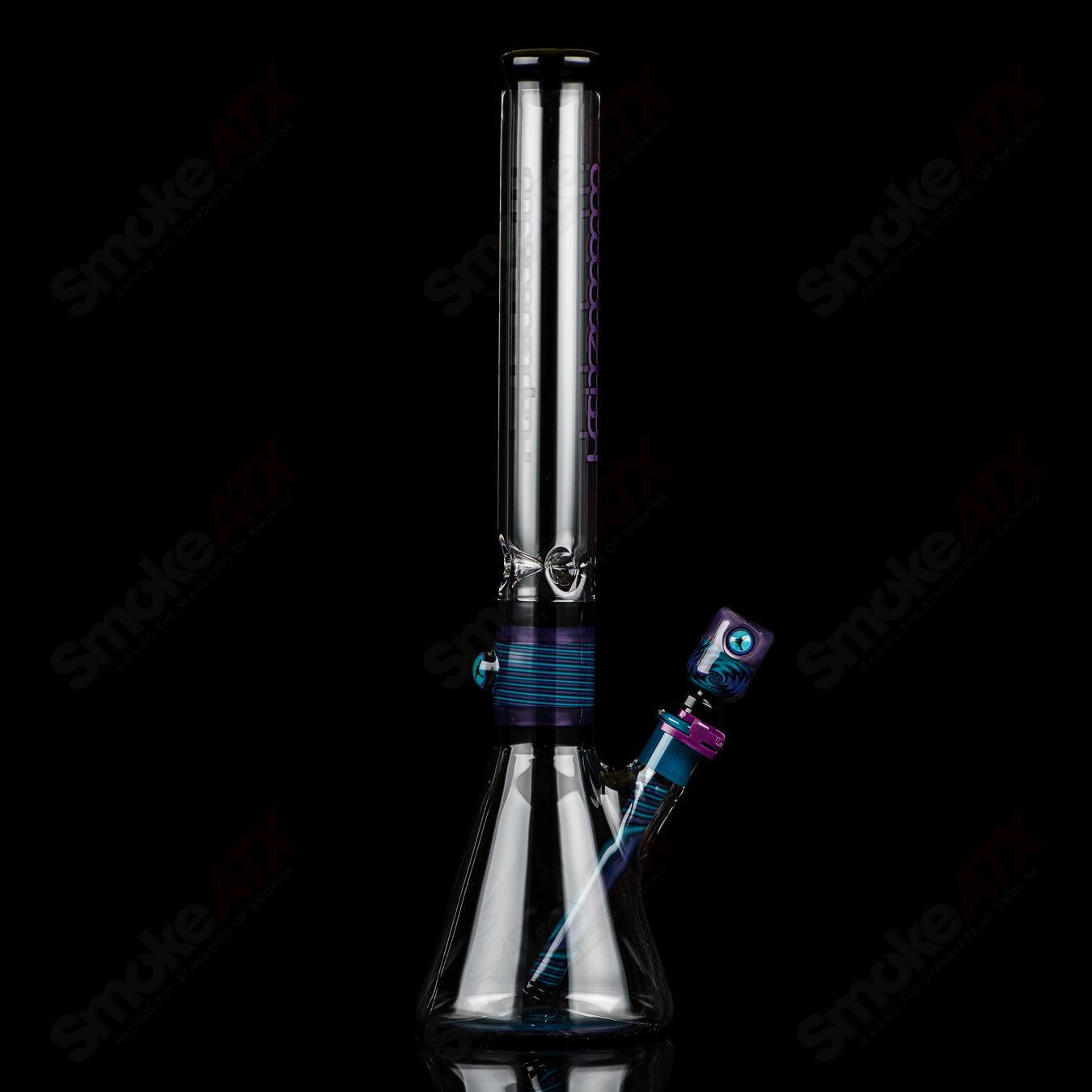 Illadelph Purple and Aqua Jordan Beaker, heady glass bong with colorful spiral design and sturdy beaker base for smooth hits.
