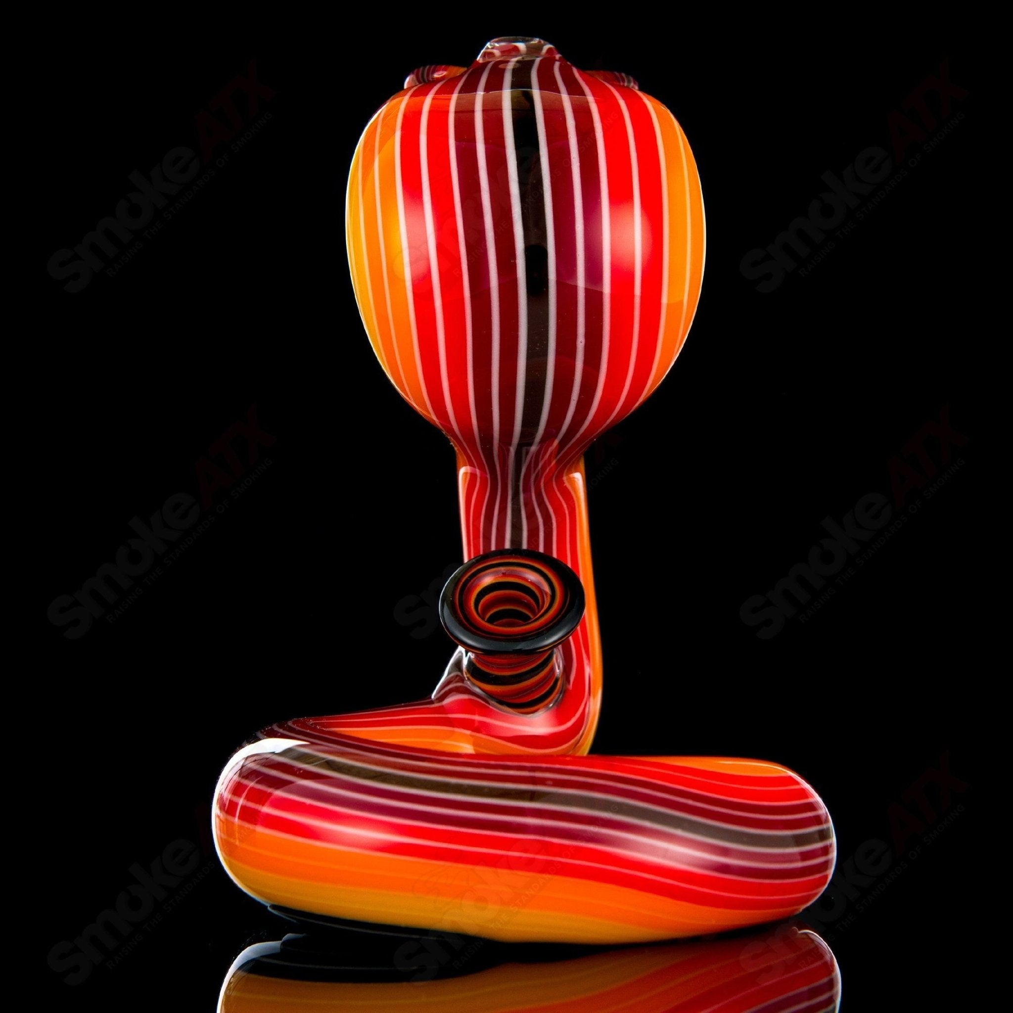 Niko Cray King Cobra Heady Glass concentrate rig with intricate cobra design and clear glass body.