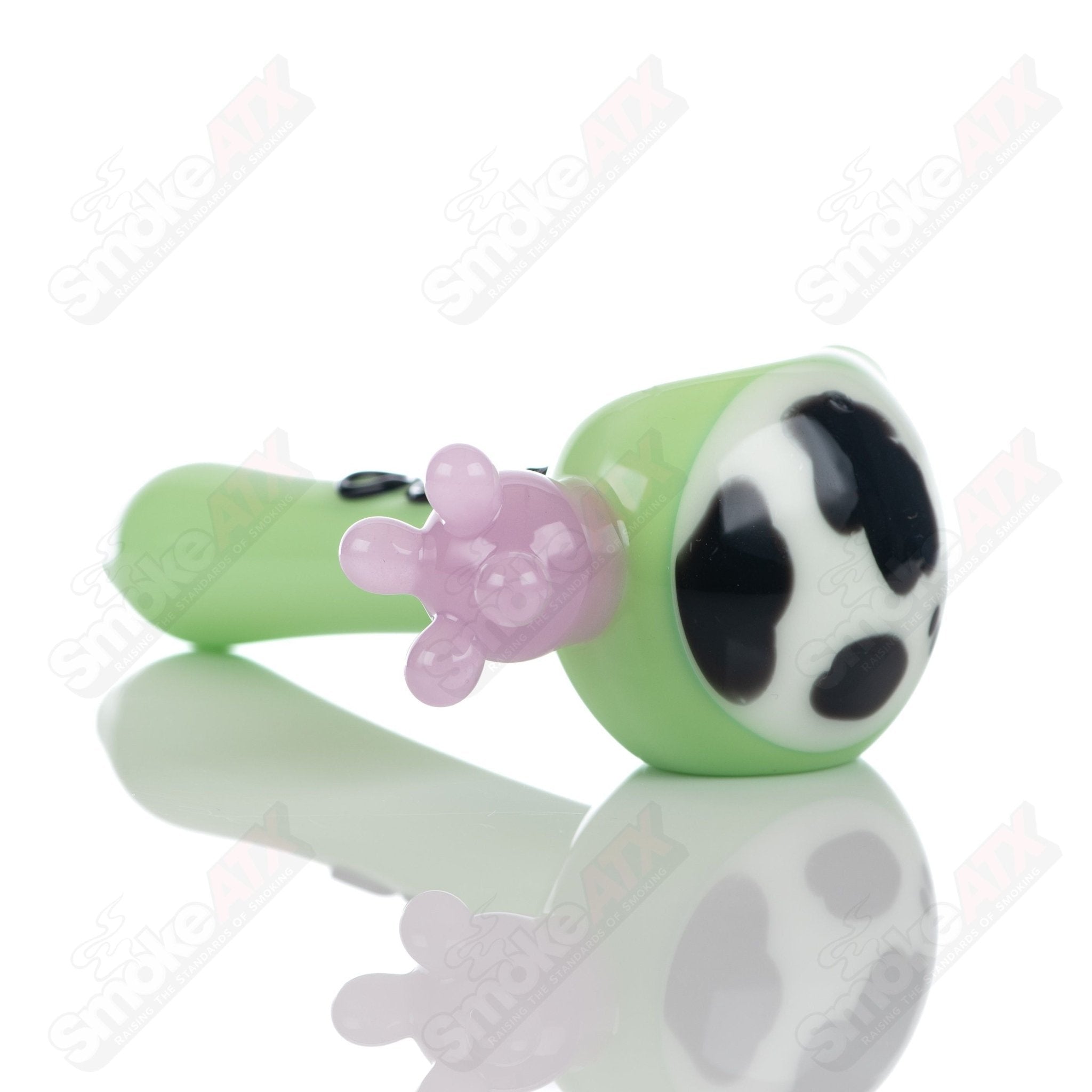 Glass spoon pipe with kiwi and cow print design by Adventures In Glass Blowing, detailed close-up of colorful, patterned glass pipe.