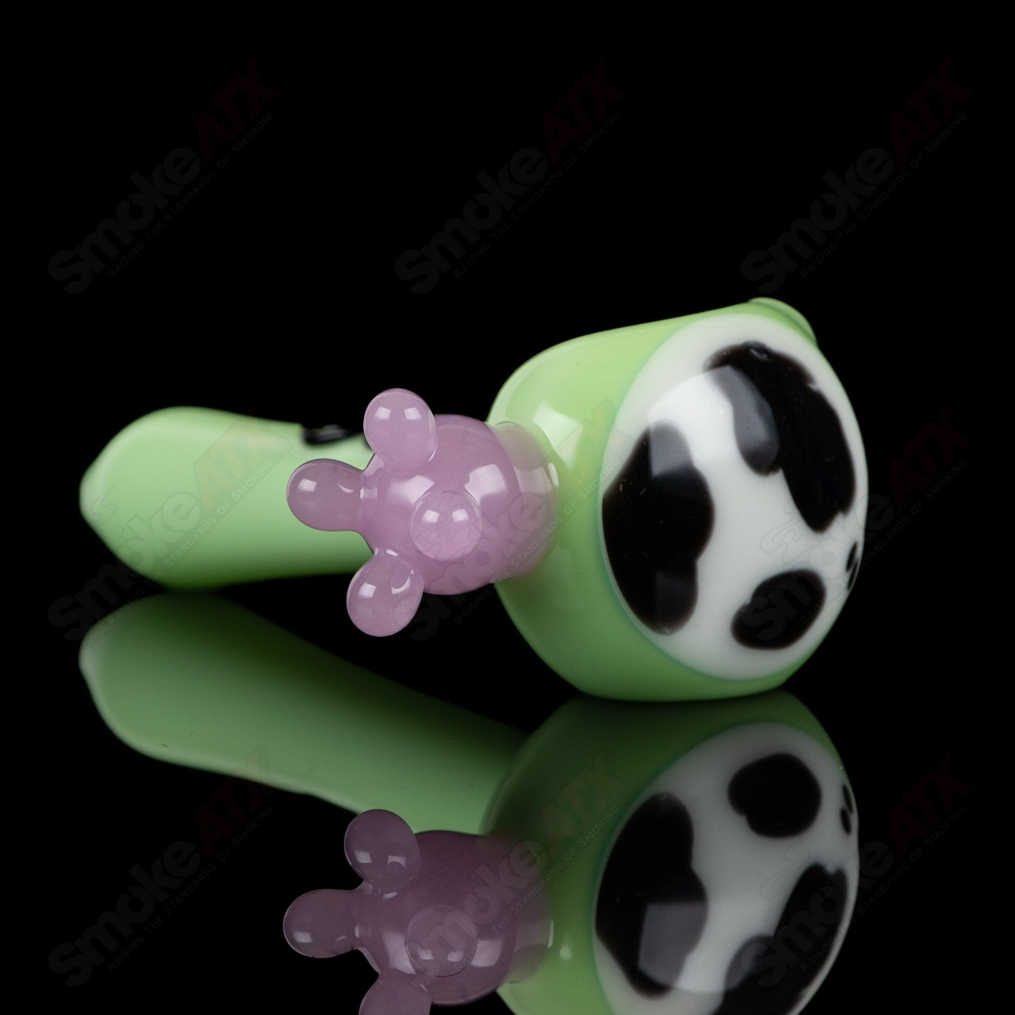 Glass spoon pipe with kiwi and cow print design by Adventures In Glass Blowing, showcasing colorful glass art and intricate details.