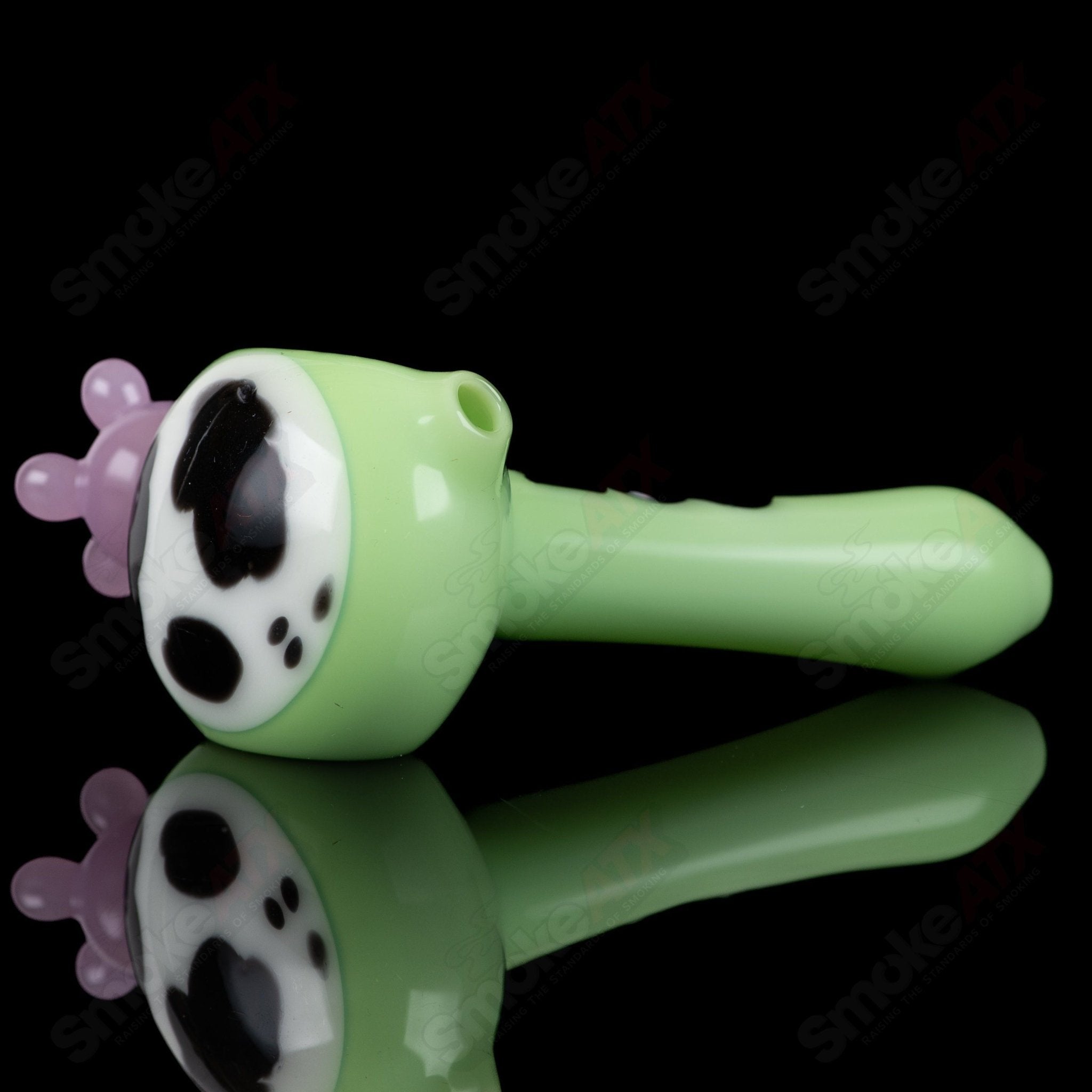 Glass spoon pipe with kiwi and cow print design by Adventures in Glass Blowing, showcasing colorful, artistic glass pipe craftsmanship.