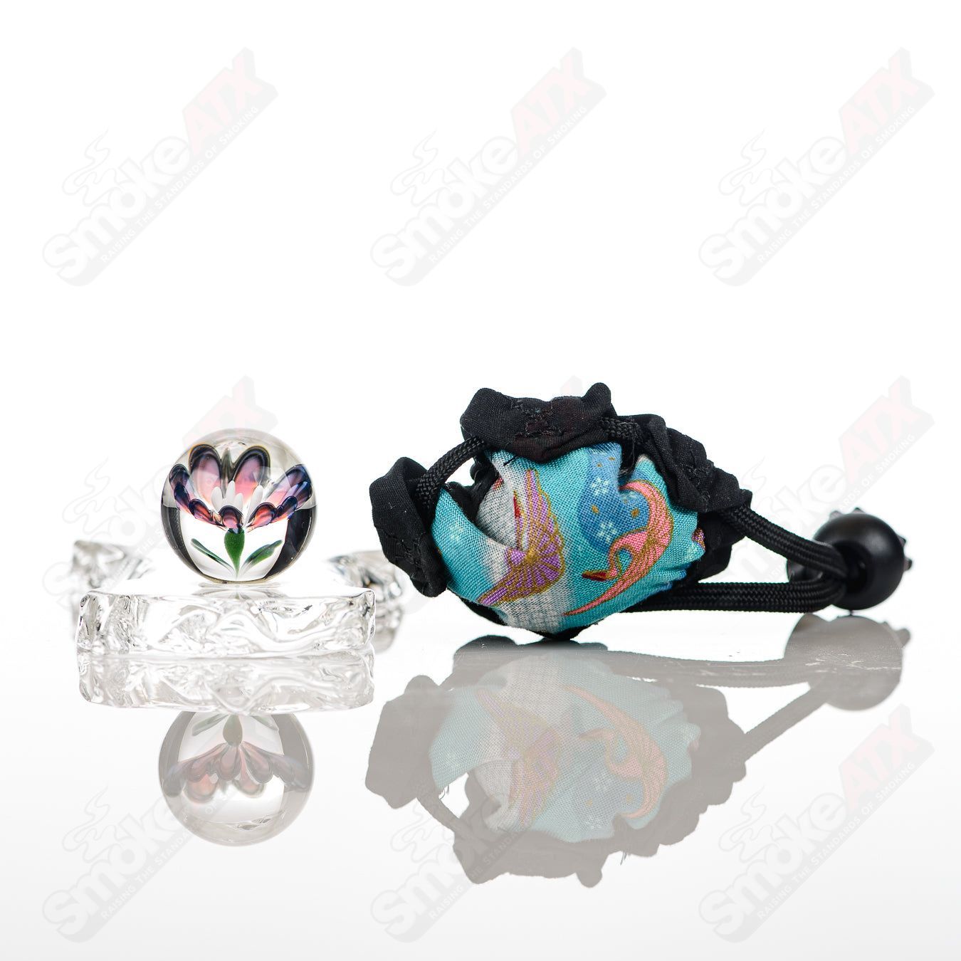 Kobuki Glass #3 Flower Topper marble with colorful flower design, clear glass body, and decorative patterns on a heady glass marble