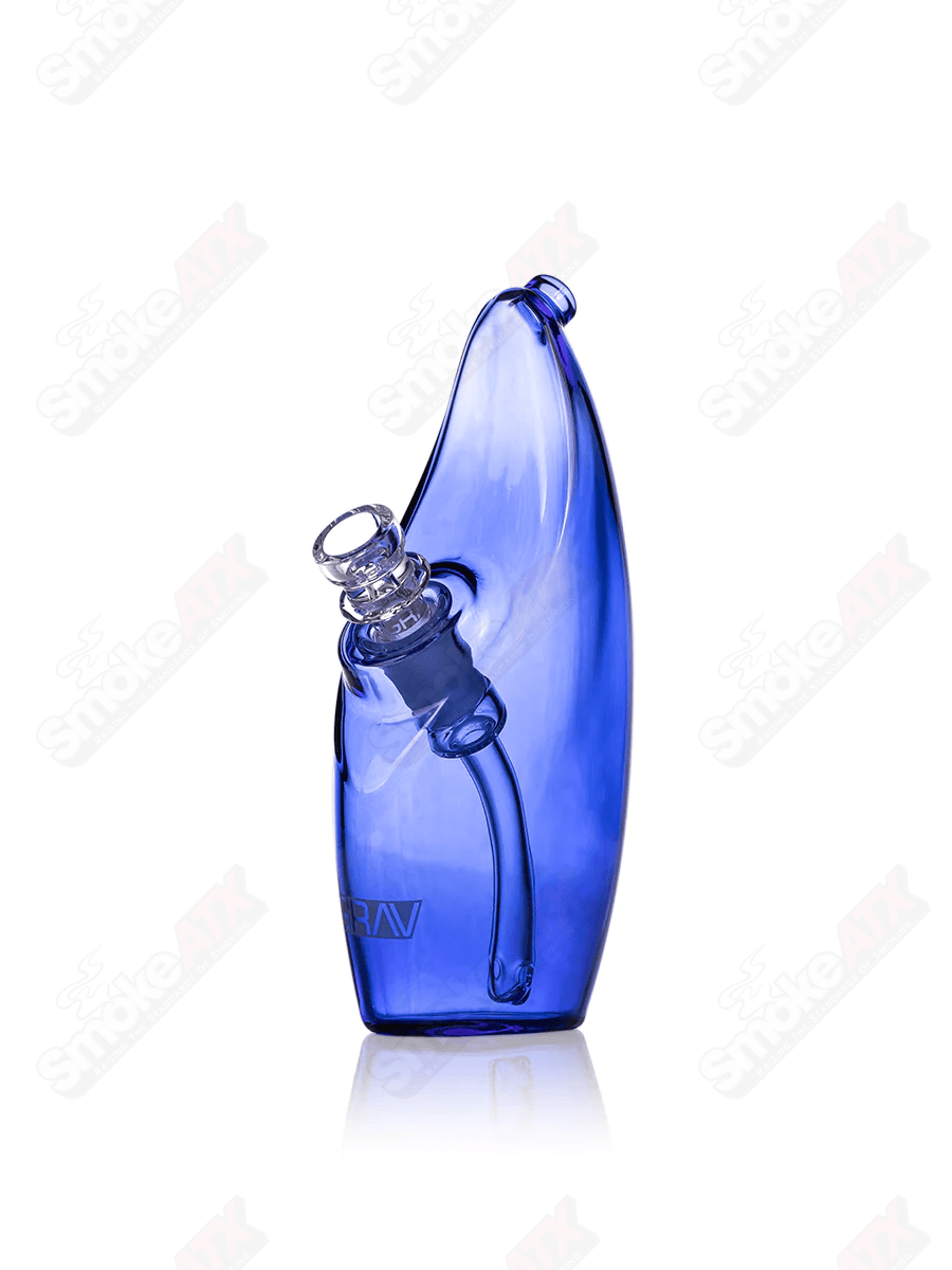 Light cobalt rain bubbler waterpipe by Grav, featuring glass construction with intricate rain-inspired design and smooth water filtration.
