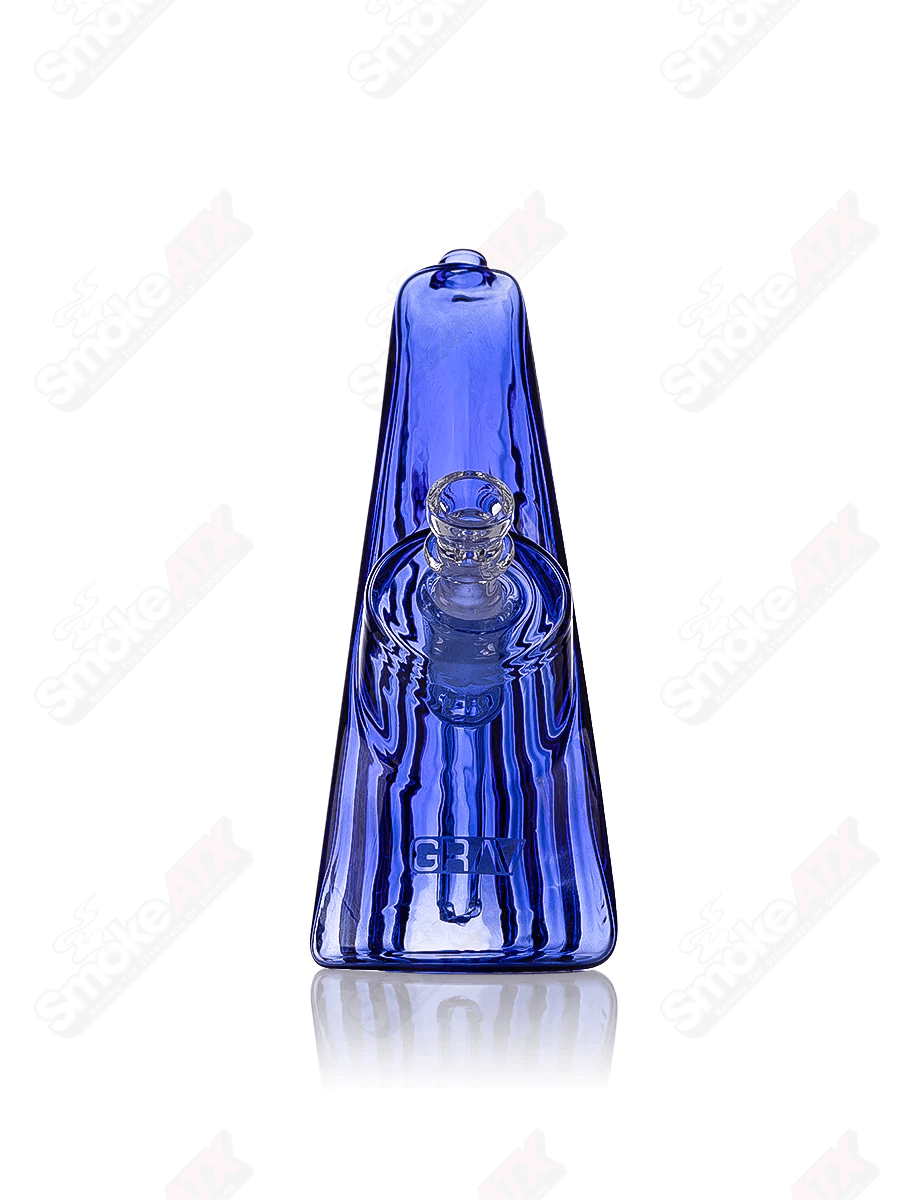 Light cobalt wave bubbler waterpipe by Grav, featuring a glass design with swirling blue patterns and a compact, portable shape.