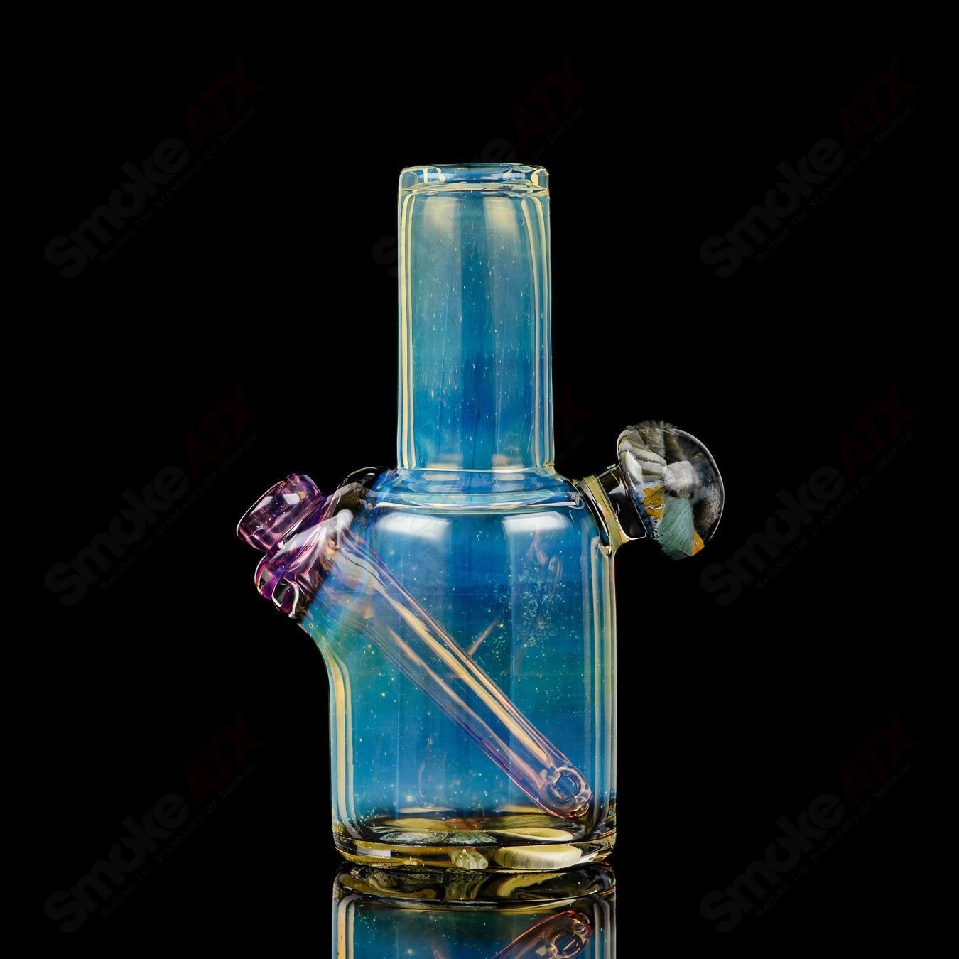 Cap’n Crunk Mini Rig #1, a colorful heady glass concentrate rig with intricate design and compact size for dabbing.