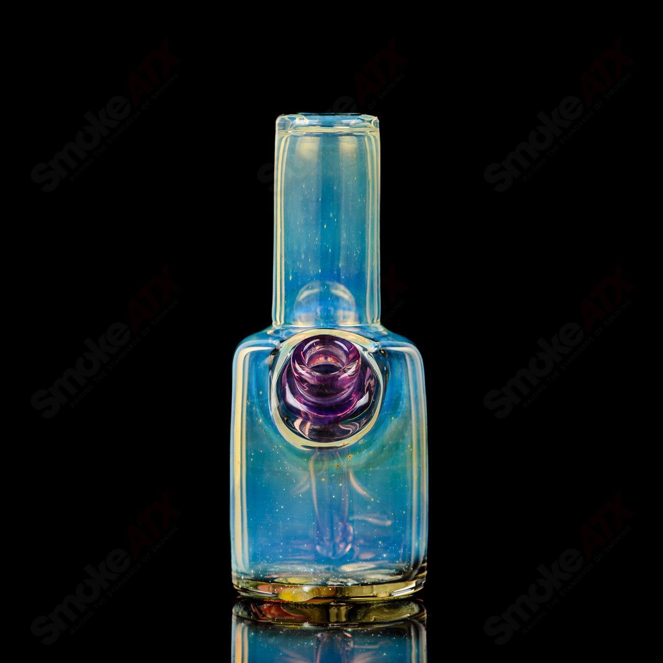 Mini Rig #1 by Cap’n Crunk, a heady glass concentrate rig with intricate design and compact size for dabbing.