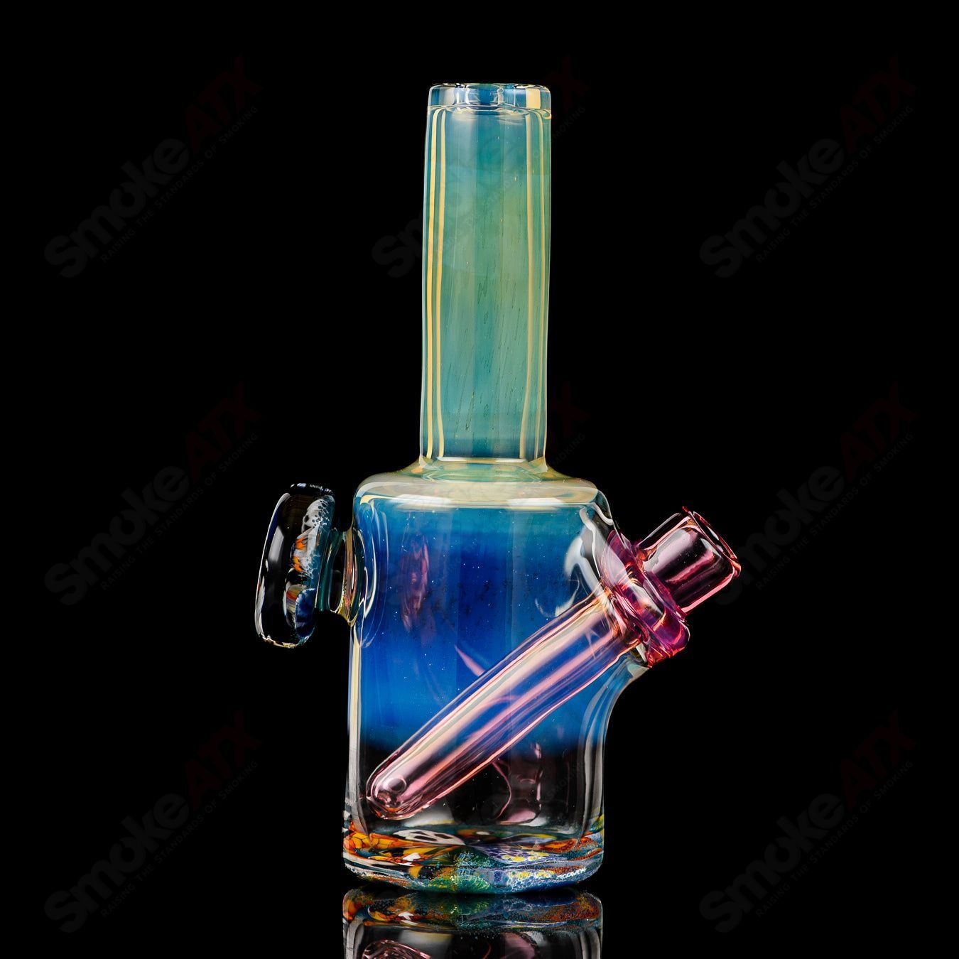Mini Rig #3 Cap’n Crunk heady glass concentrate rig with colorful swirling patterns and a compact, artistic design.