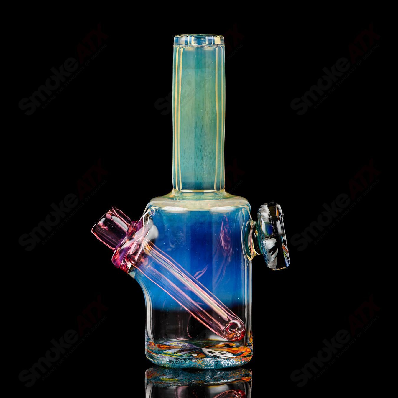 Mini Rig #3 by Cap’n Crunk, a heady glass concentrate rig with a compact design and colorful glass detailing.