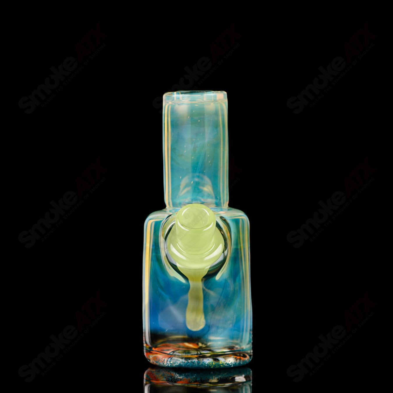 Mini Rig #4 by Cap’n Crunk, a heady glass concentrate rig with intricate design and clear glass body.