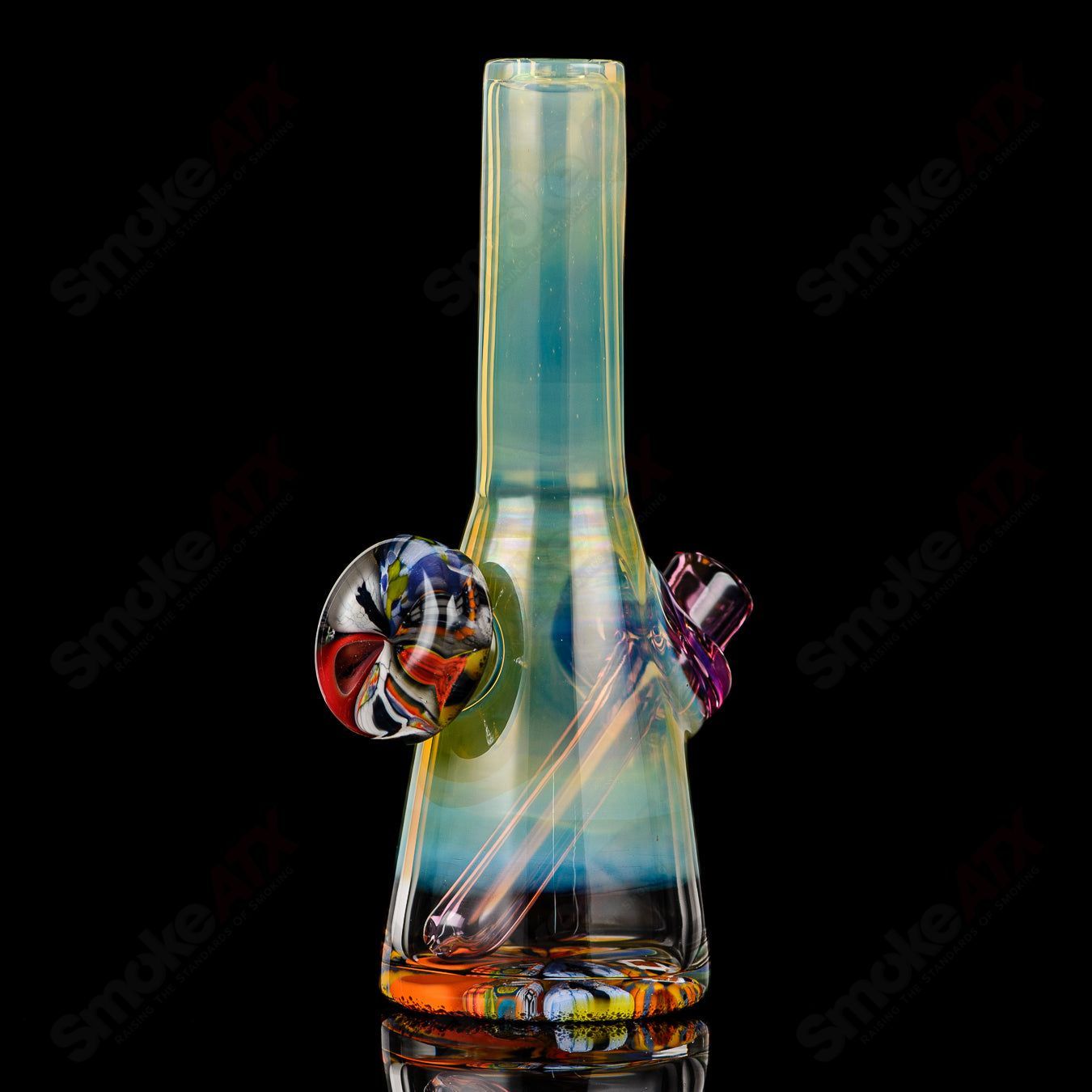 Mini Rig #6 by Cap’n Crunk, a heady glass concentrate rig with intricate design and clear glass construction.