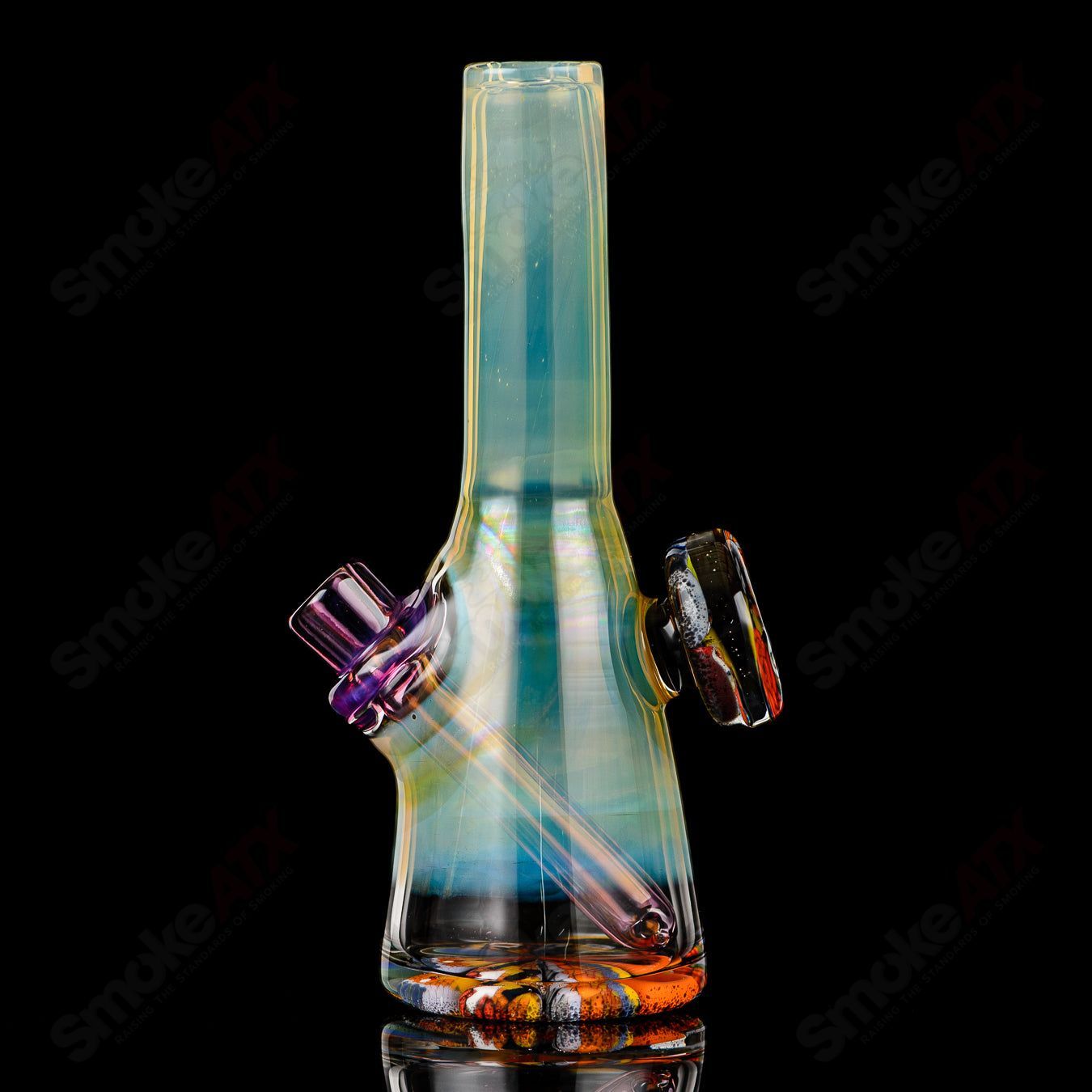 Mini Rig #6 by Cap’n Crunk, a heady glass concentrate rig with colorful design and compact size for dabbing.