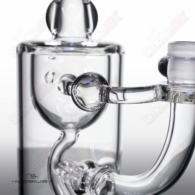 Mobius Recurve Heady Glass Incycler with clear glass and intricate design, showcasing the unique shape and craftsmanship.