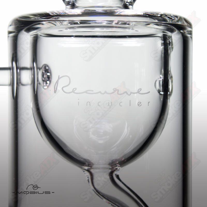 Mobius Recurve Heady Glass incyclers with a sleek, curved design and clear glass construction, showcasing intricate craftsmanship.