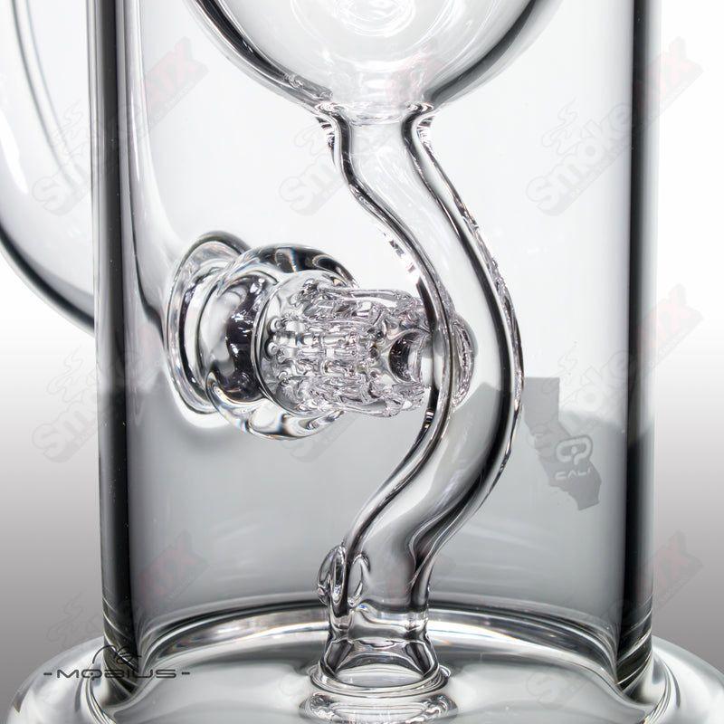 Mobius Recurve Heady Glass incyclers with a sleek, curved design and vibrant glasswork, showcasing craftsmanship and artistic detail.