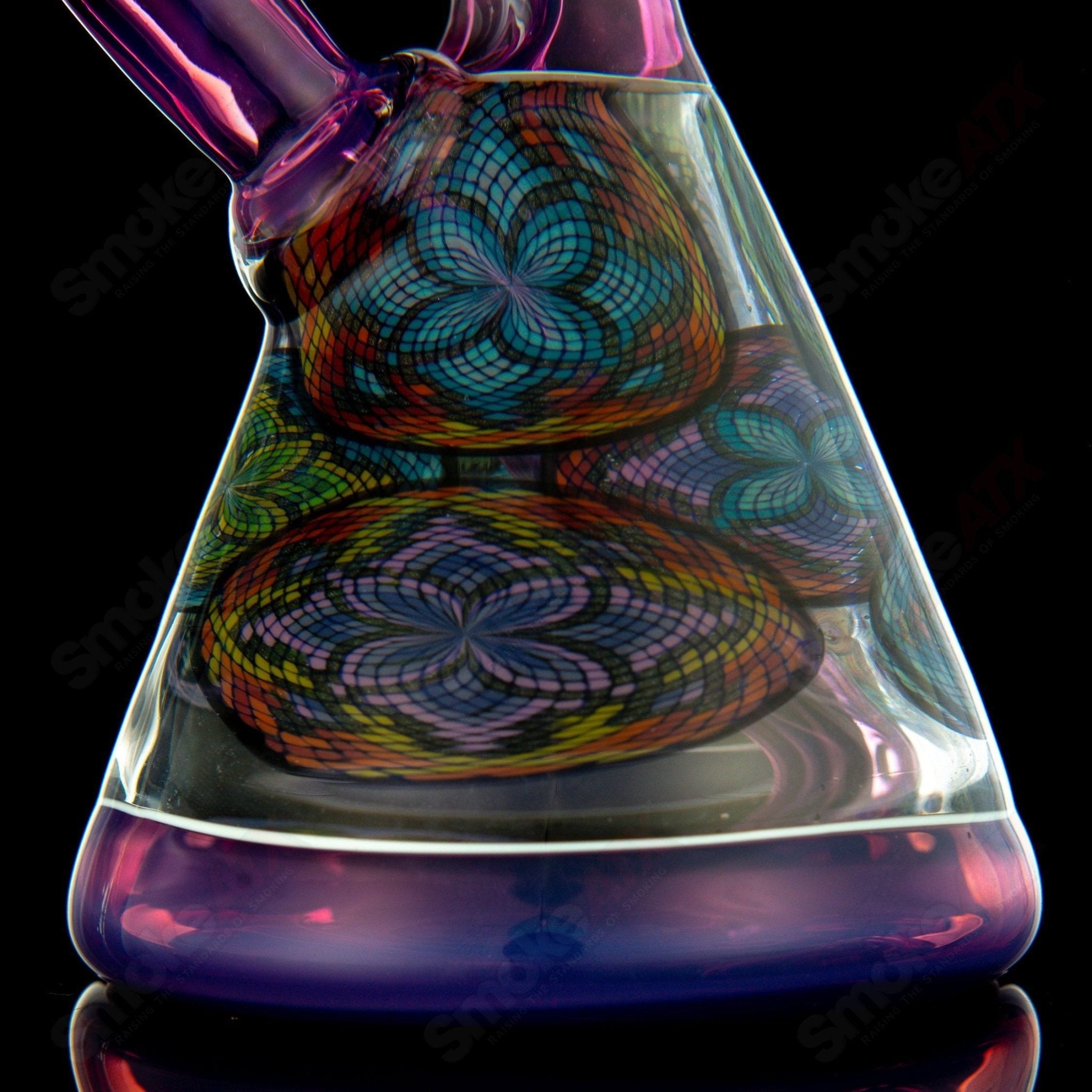 Multiple Filla Beakers by John W Glass, colorful heady glass beakers with intricate designs, displayed together.