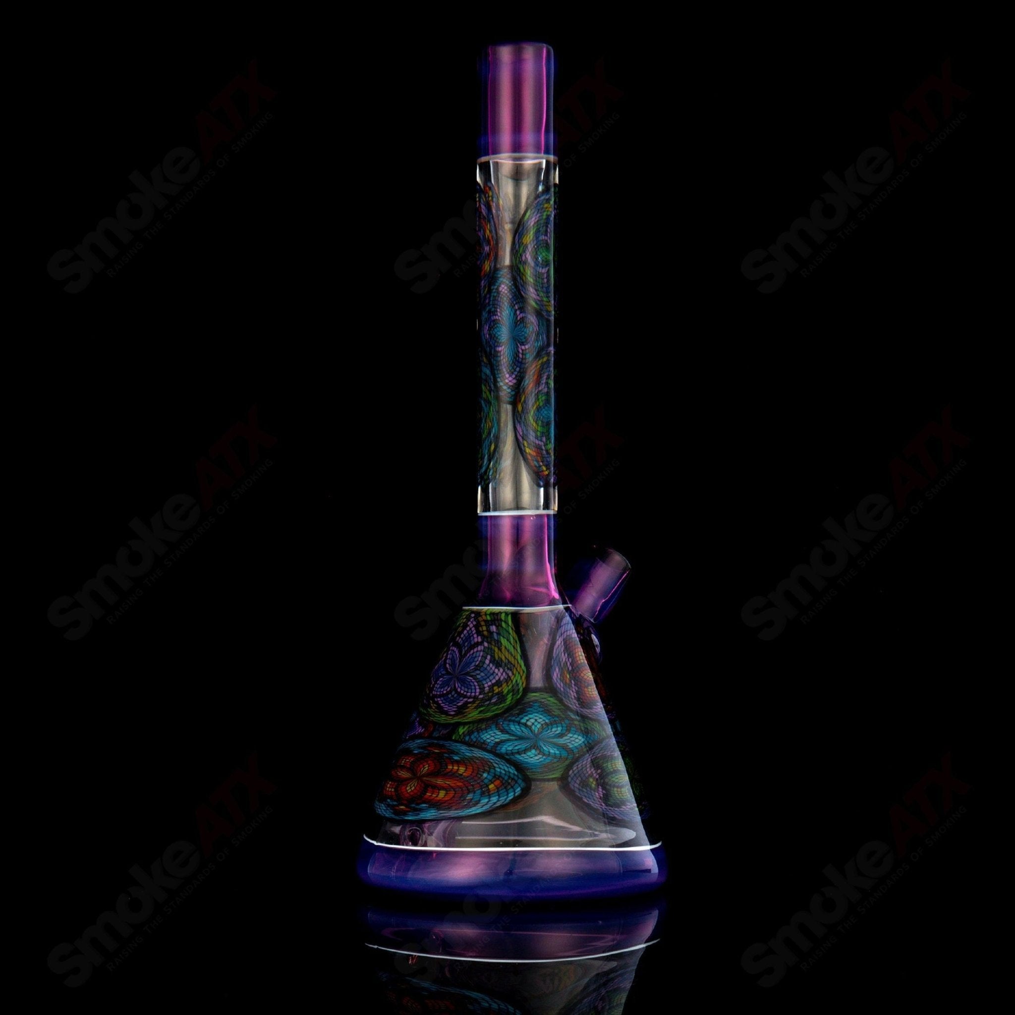 Multiple colorful Filla Beaker John W Glass heady glass beakers arranged together, showcasing vibrant designs and intricate glasswork.