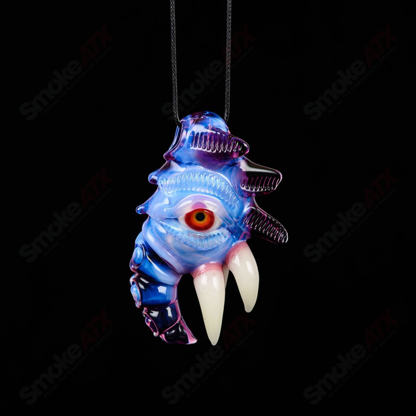 Gold amethyst and lucid glass pendant from Salt Glass, featuring intricate heady glass design with vibrant colors and detailed craftsmanship.