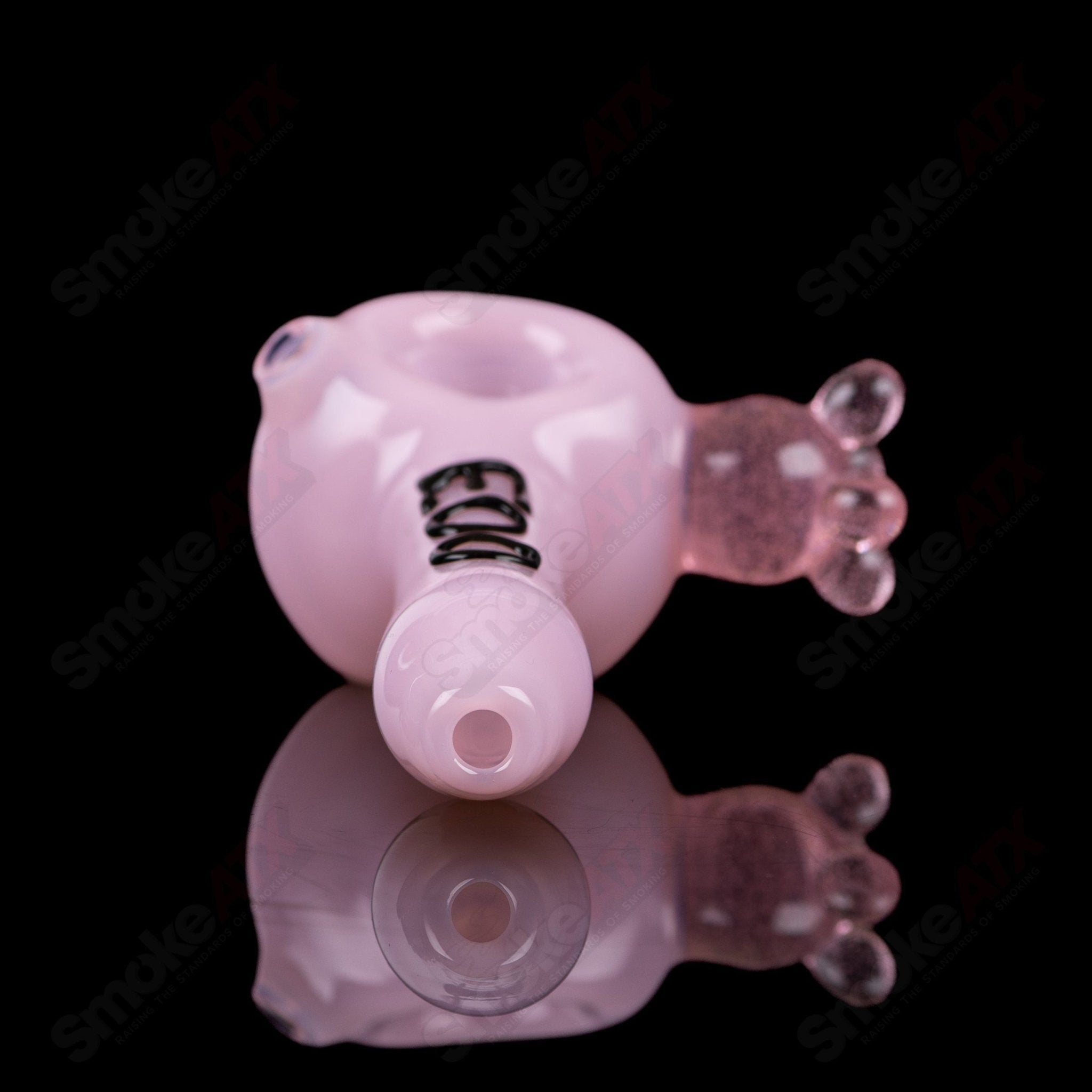 Pink cow print glass spoon pipe by Adventures In Glass Blowing, featuring a colorful design and smooth glass craftsmanship.