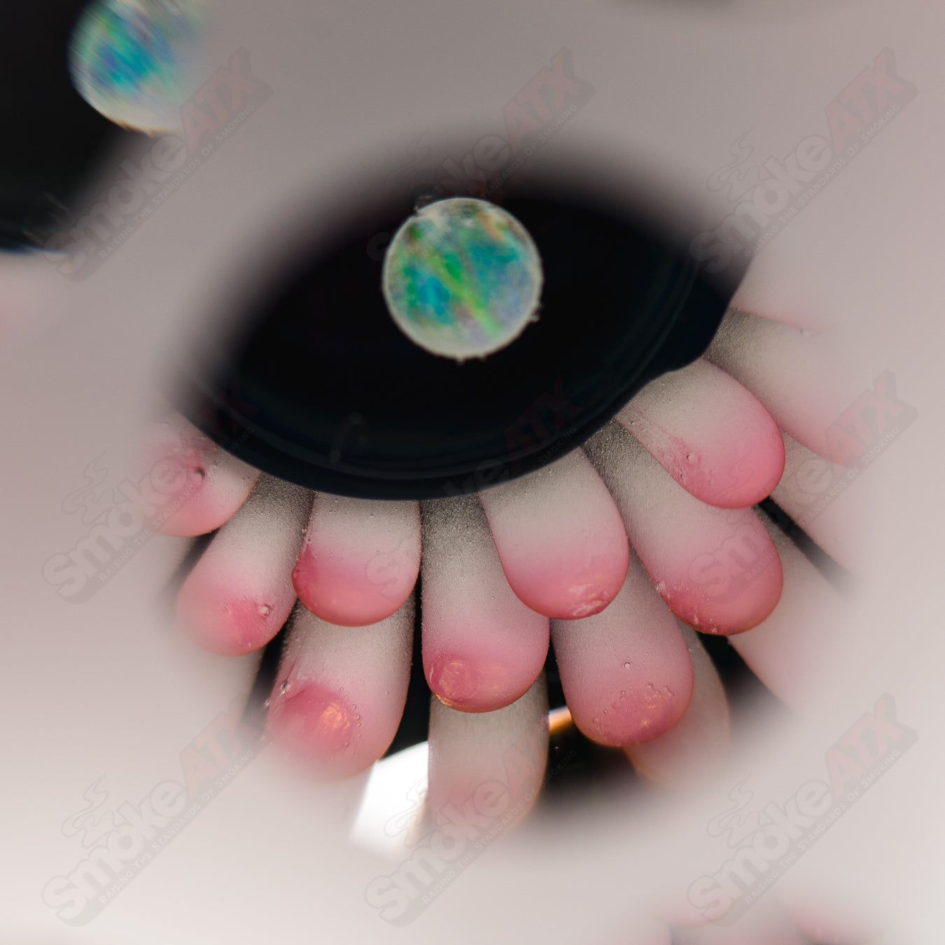 Pink faceted marble Raj K glass from Raj Kommineni Glass, featuring colorful glass marbles and intricate heady glass design.