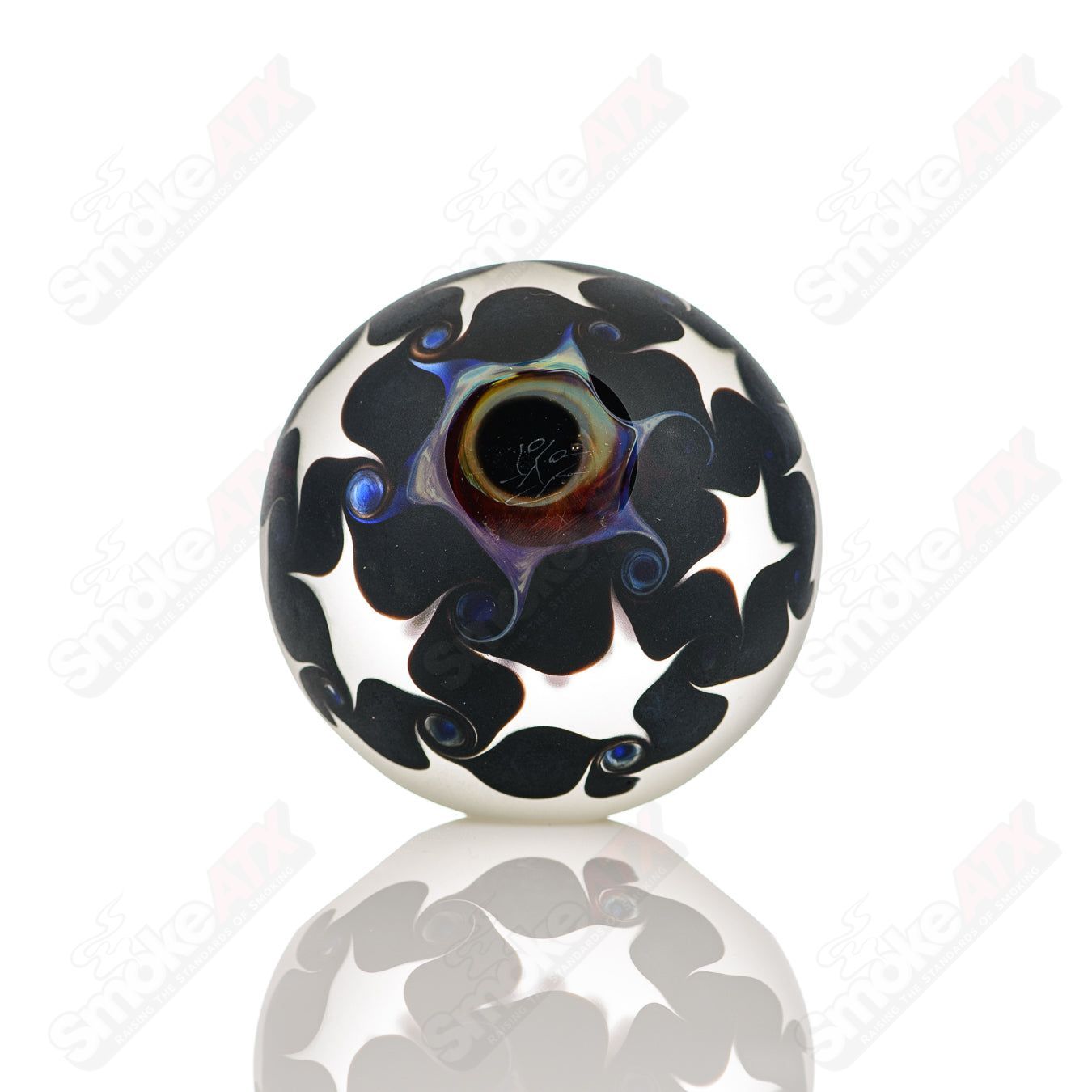 Pink faceted marble Raj K glass from Raj Kommineni Glass, showcasing intricate glass marbles with a glossy pink finish.