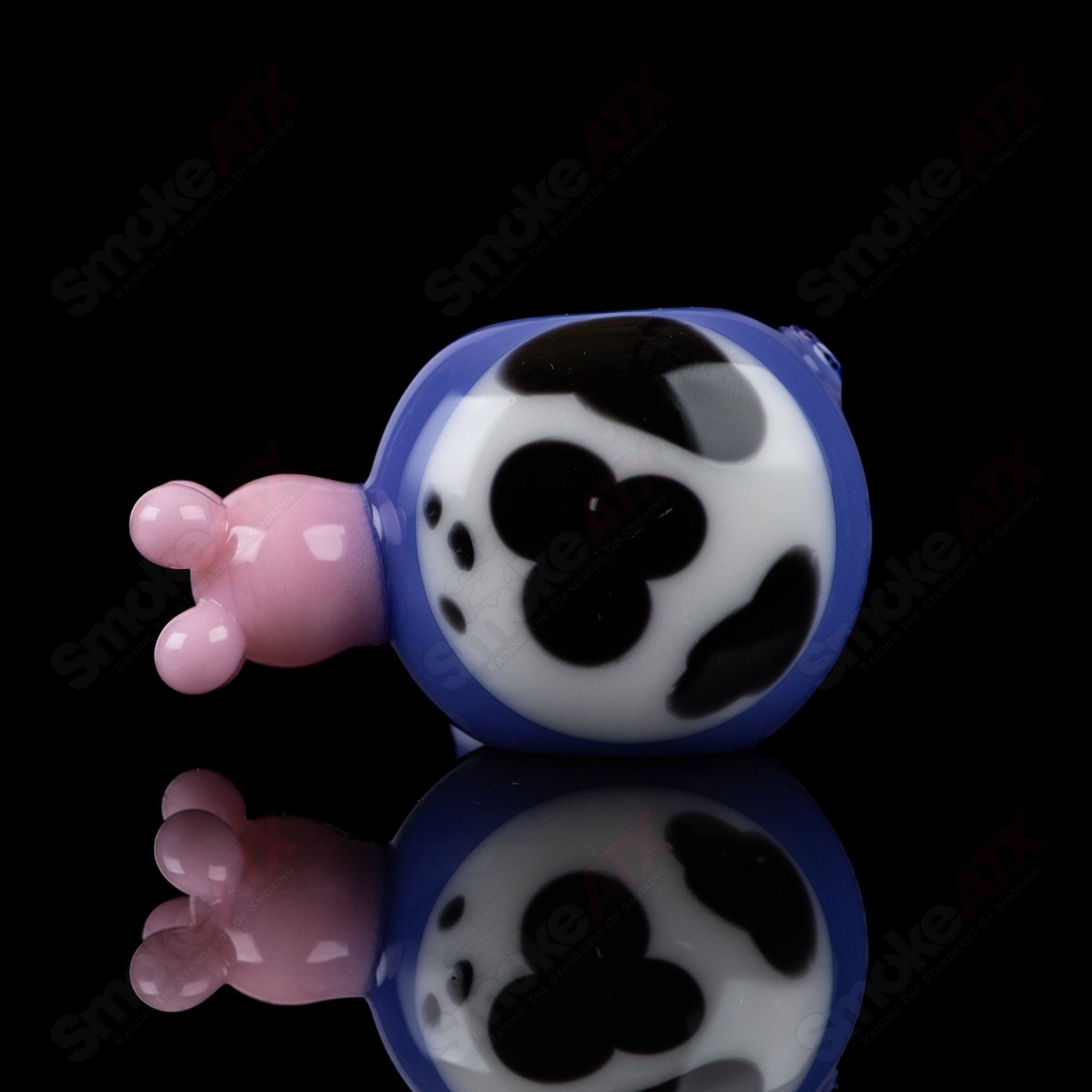 Purple cow print glass spoon pipe by Adventures In Glass Blowing, featuring a smooth bowl and intricate design.