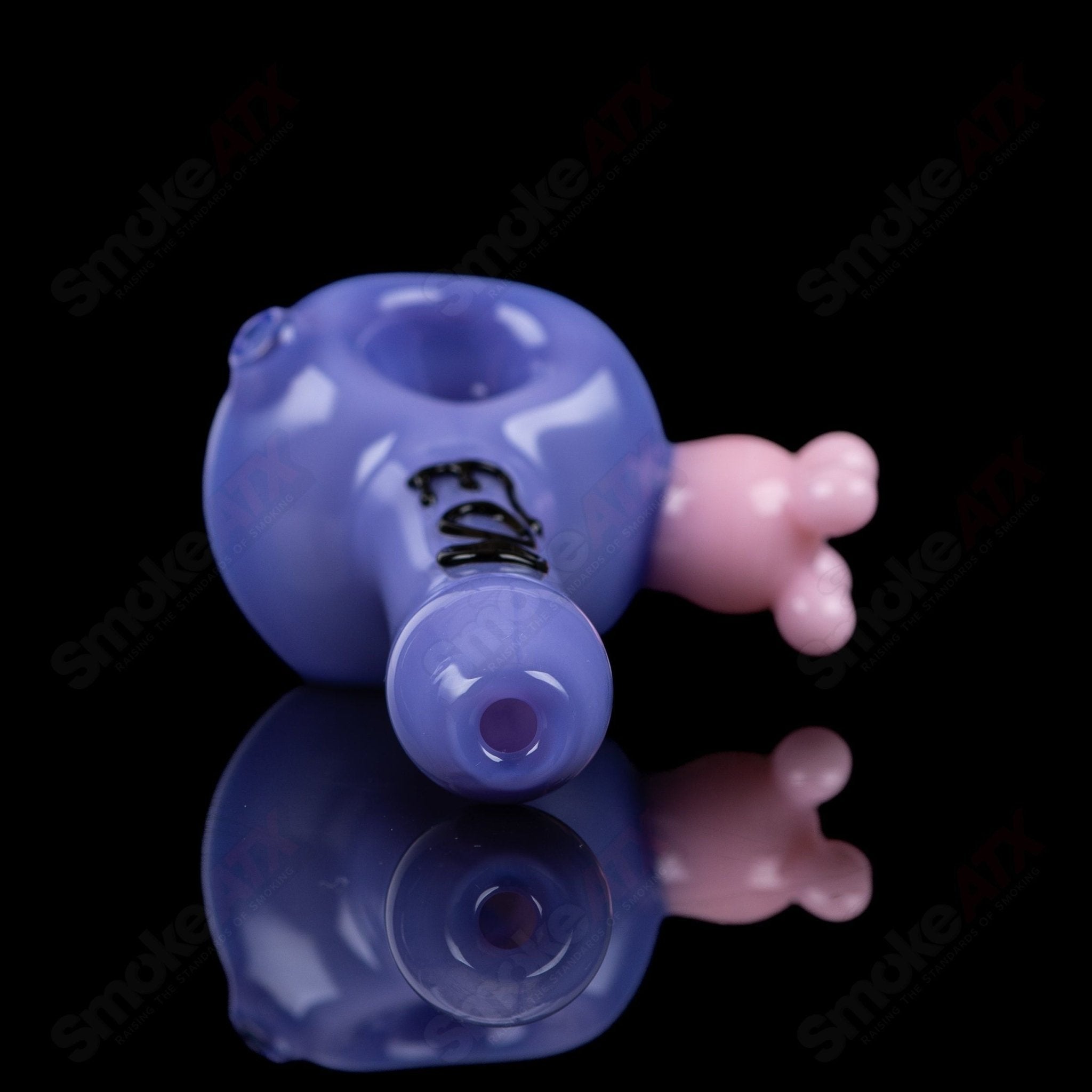 Purple cow print glass spoon pipe by Adventures In Glass Blowing, showcasing intricate design and smooth glass craftsmanship.