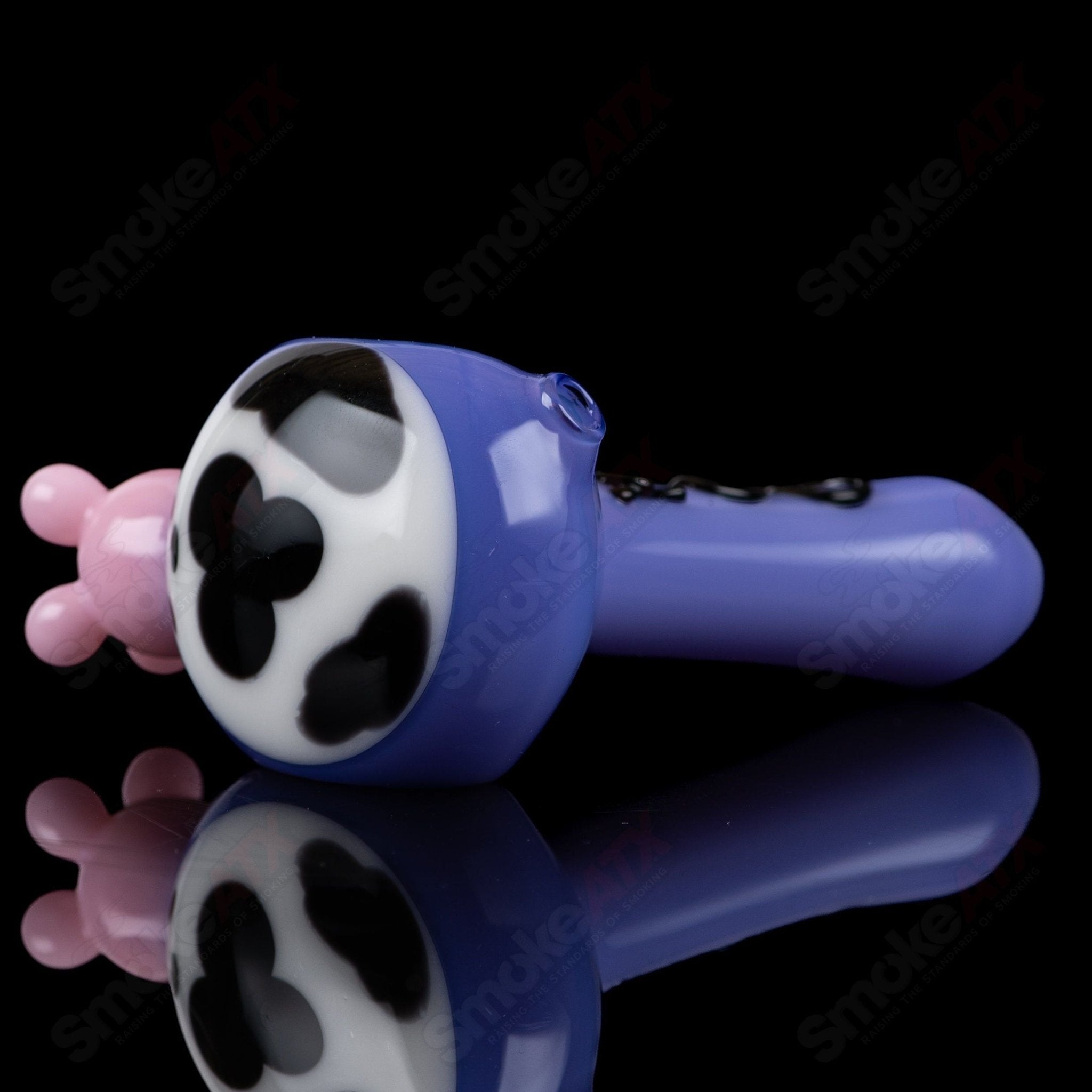 Purple cow print glass spoon pipe by Adventures In Glass Blowing, showcasing intricate design and smooth glass craftsmanship.