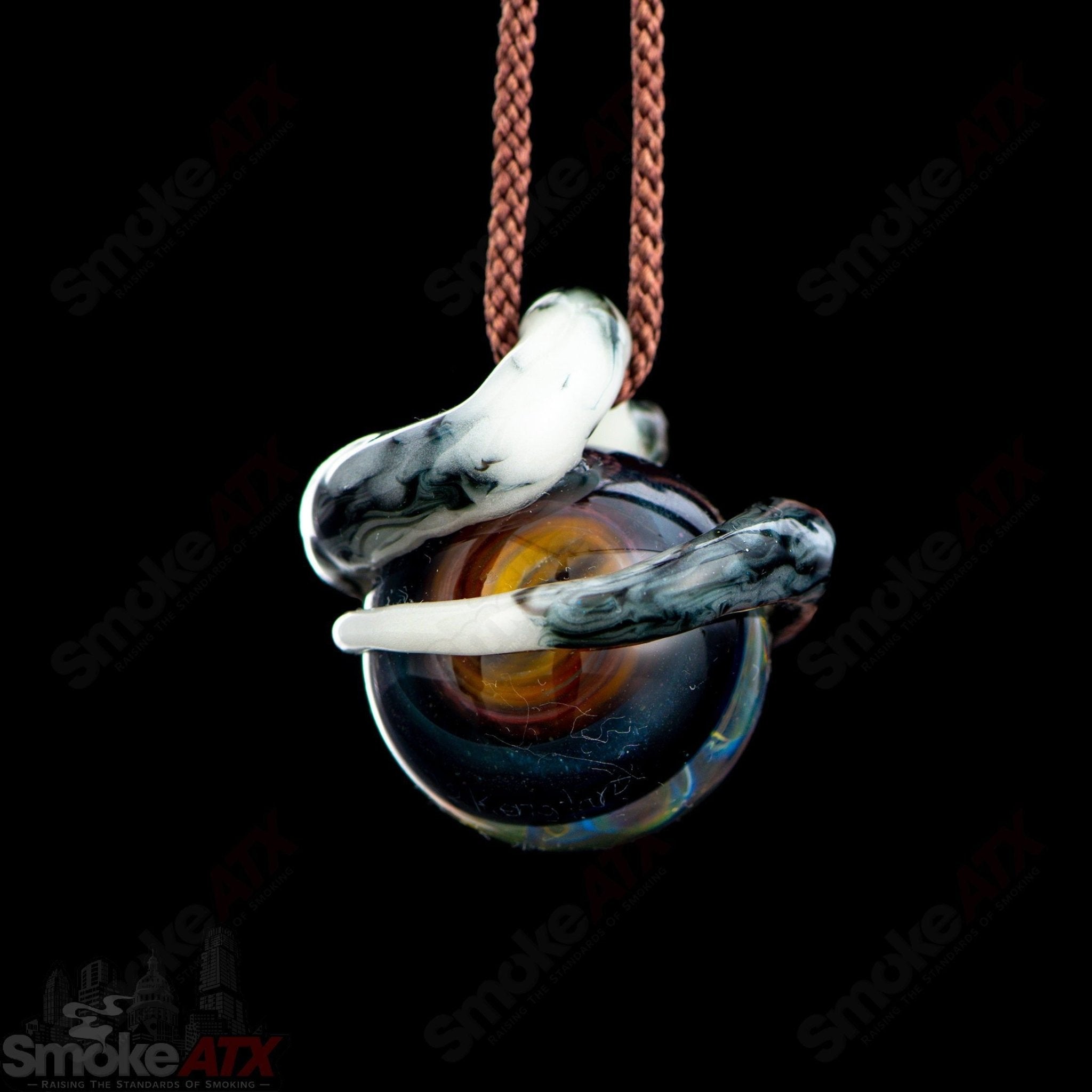Kengtaro Python Pendant made of colorful glass, featuring a detailed snake design, suitable for wearing as a heady glass pendant.